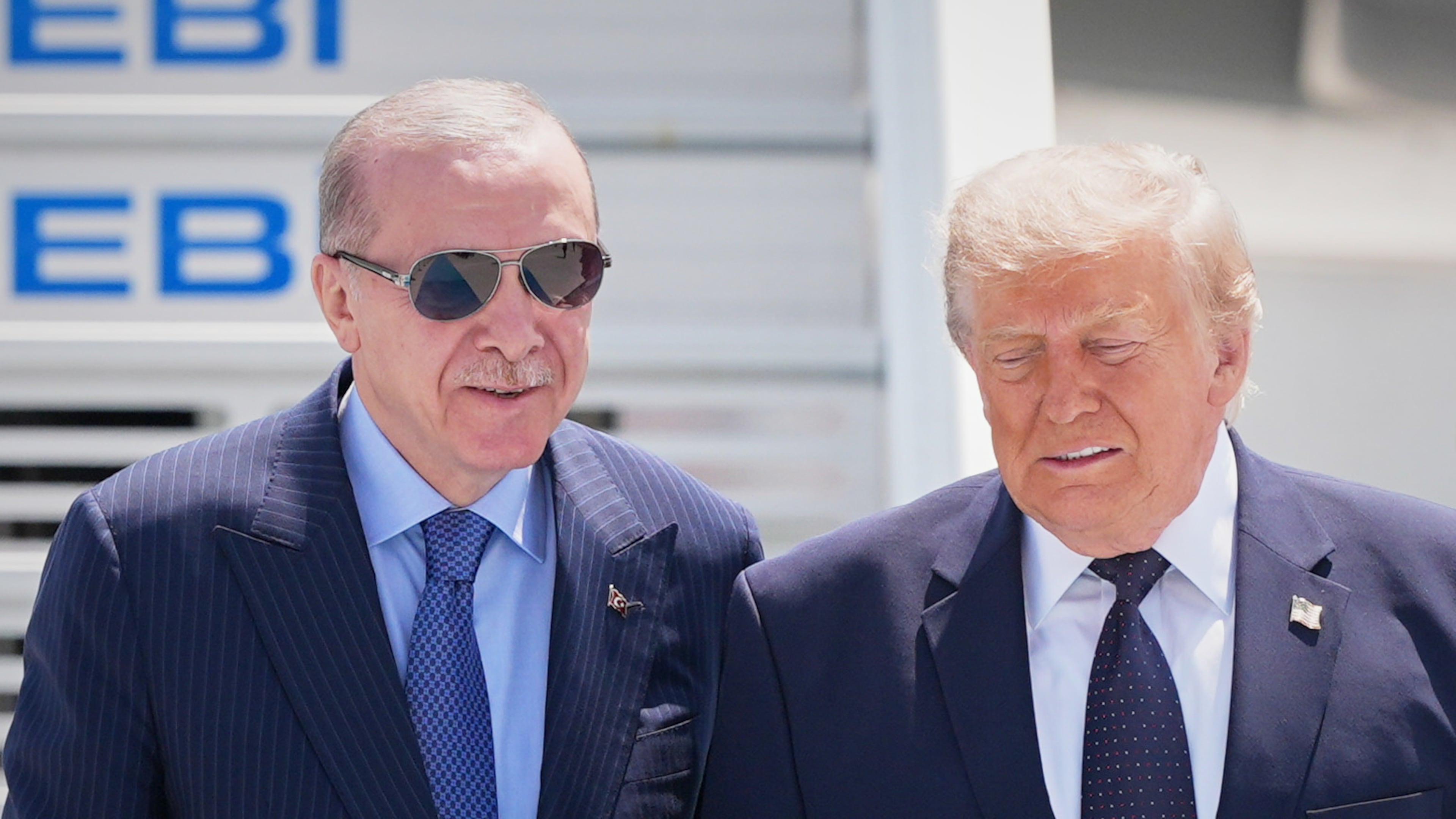 President Donald Trump walks with Turkish President Recep Tayyip Erdogan, left, upon arriving for the NATO summit in Ankara, Turkey, Tuesday, July 7, 2026. (AP Photo/Alex Brandon)
