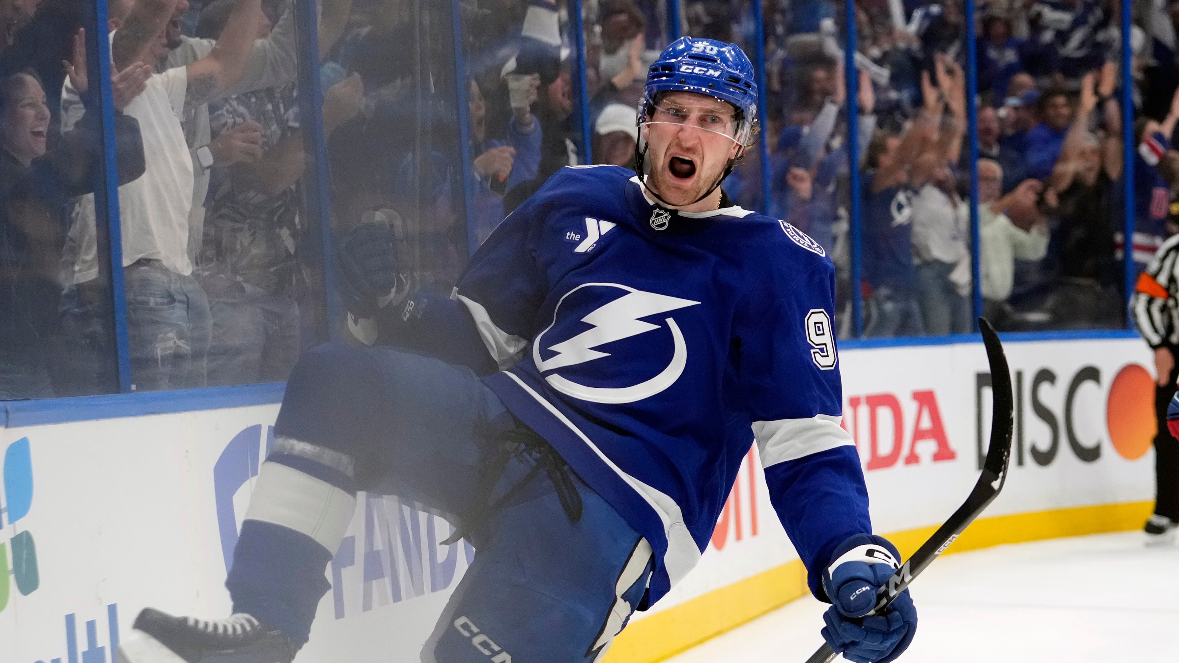 Tampa Bay Lightning defenseman J.J. Moser (90) celebrates after scoring the game-winning goal against the Montréal Canadiens during overtime in Game 2 of an NHL hockey Stanley Cup first-round playoff series, Tuesday, April 21, 2026, in Tampa, Fla. (AP Photo/Chris O'Meara)