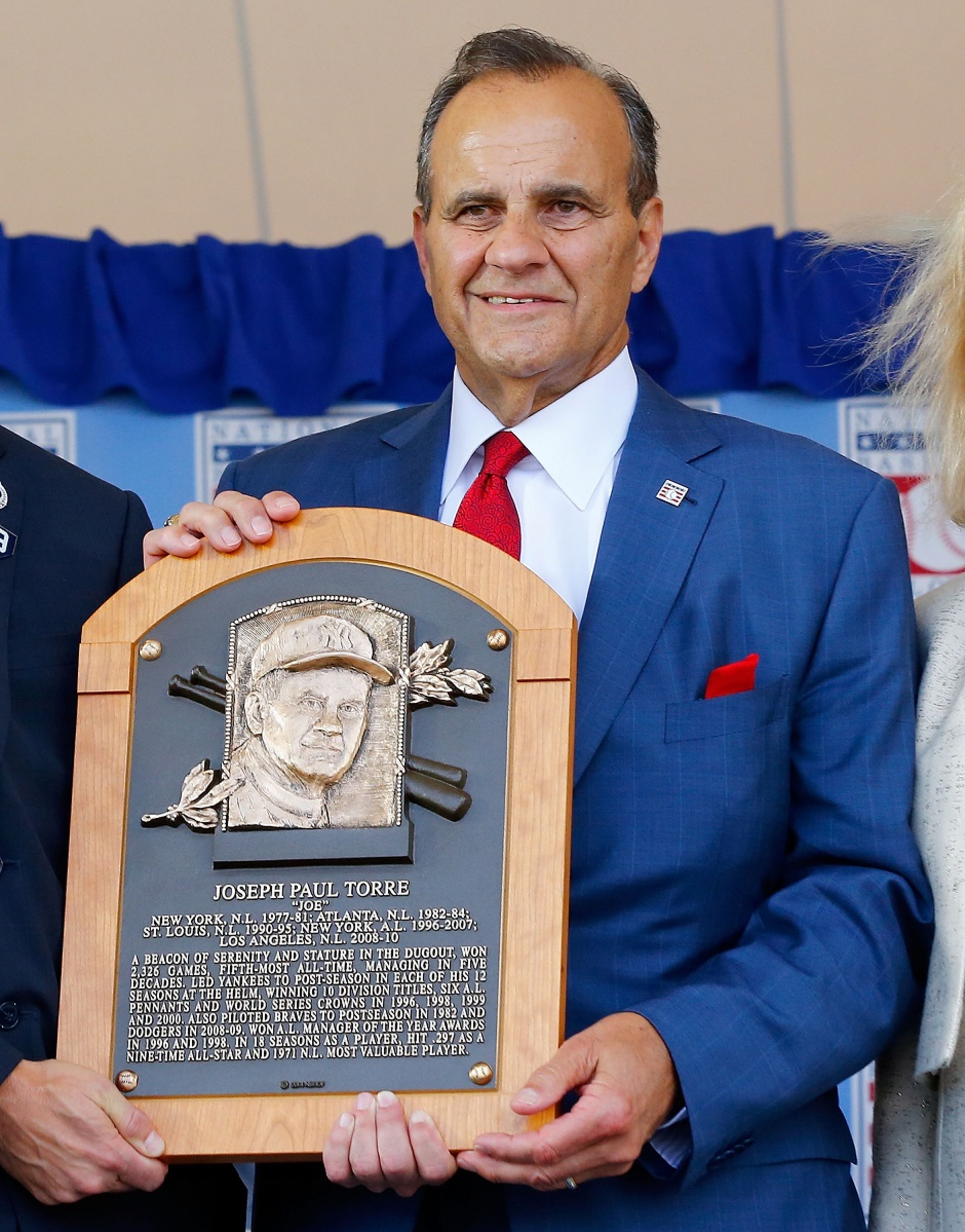 Inductee Joe Torre holds his plaque at Clark Sports Center during the Baseball Hall of Fame induction ceremony on July 27, 2014 in Cooperstown, New York. Torre managed for 29 seasons with 2,326 victories and led the New York Yankees to six American League pennants and four World Series titles. (Photo by Jim McIsaac/Getty Images)