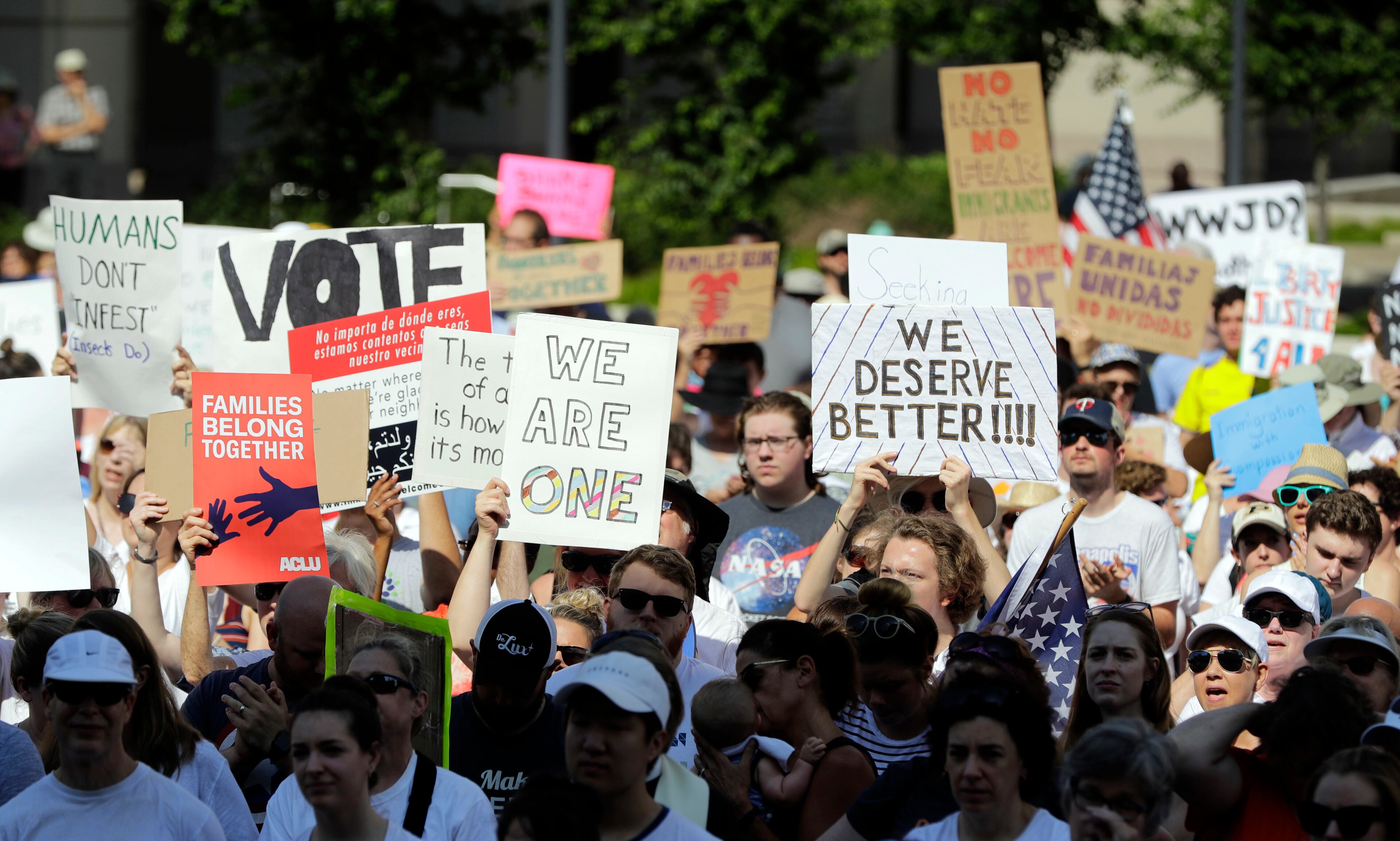 Activists gather to protest the Trump administration's approach to illegal border crossings and separation of children from immigrant parents at the Statehouse, Saturday, June 30, 2018, in Indianapolis. (AP Photo/Darron Cummings)