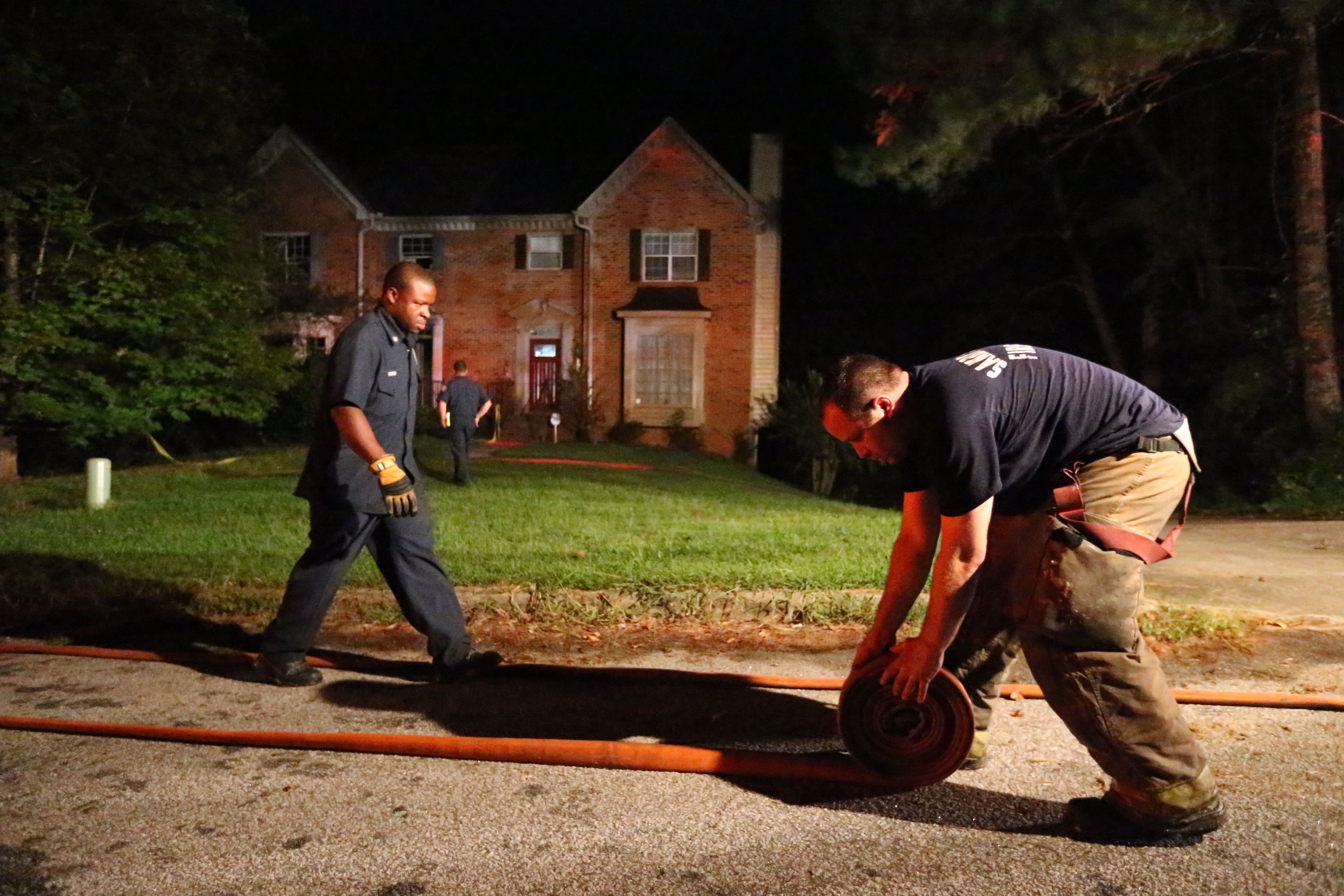 Two people died early Monday after being pulled from a burning home in Sandy Springs. The fire broke out around midnight in a duplex on North River Parkway. | JOHN SPINK/jspink@ajc.om