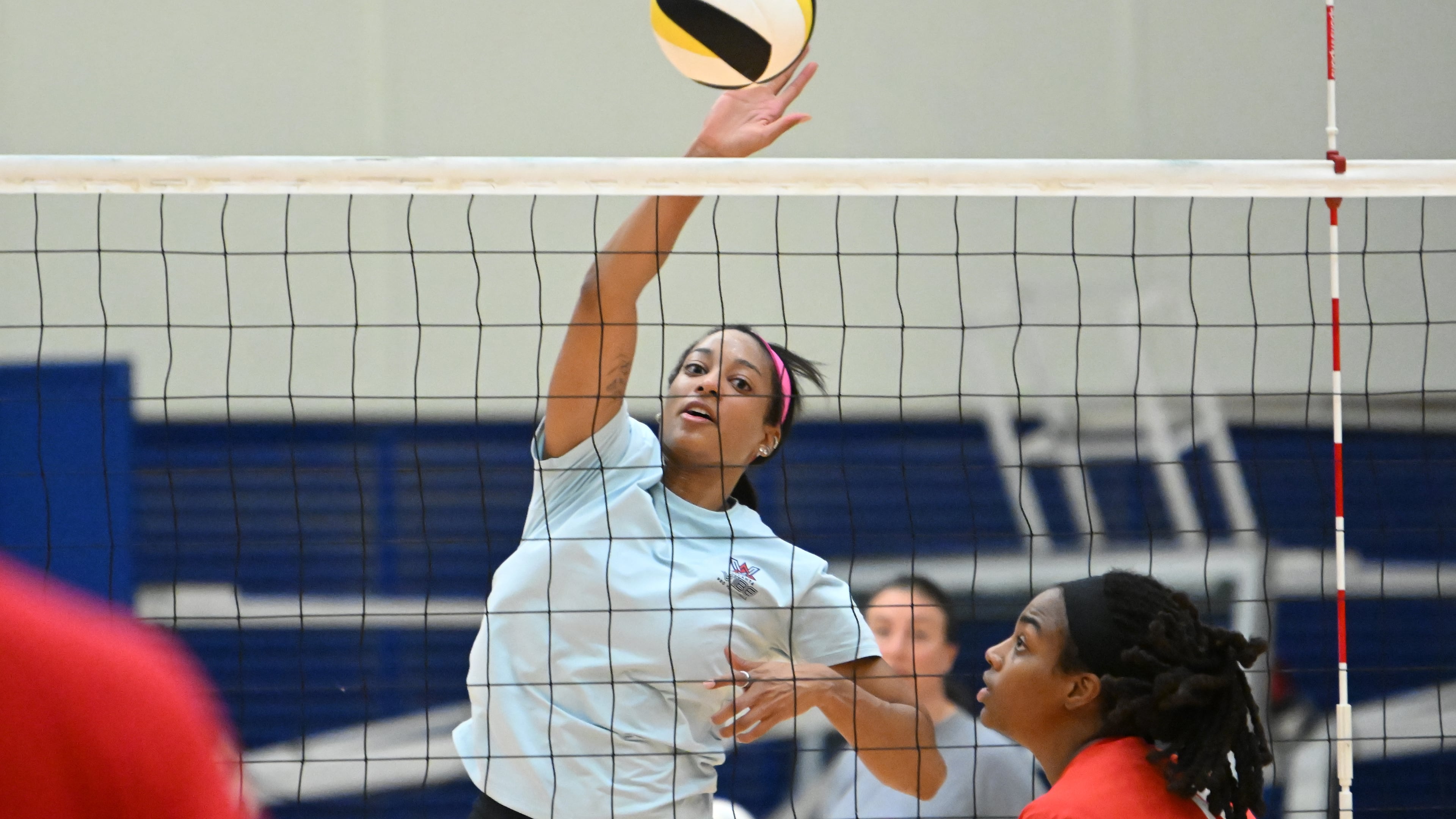 The Atlanta Vibe's Leah Edmond leaps to smack the ball during a practice. AJC file photo