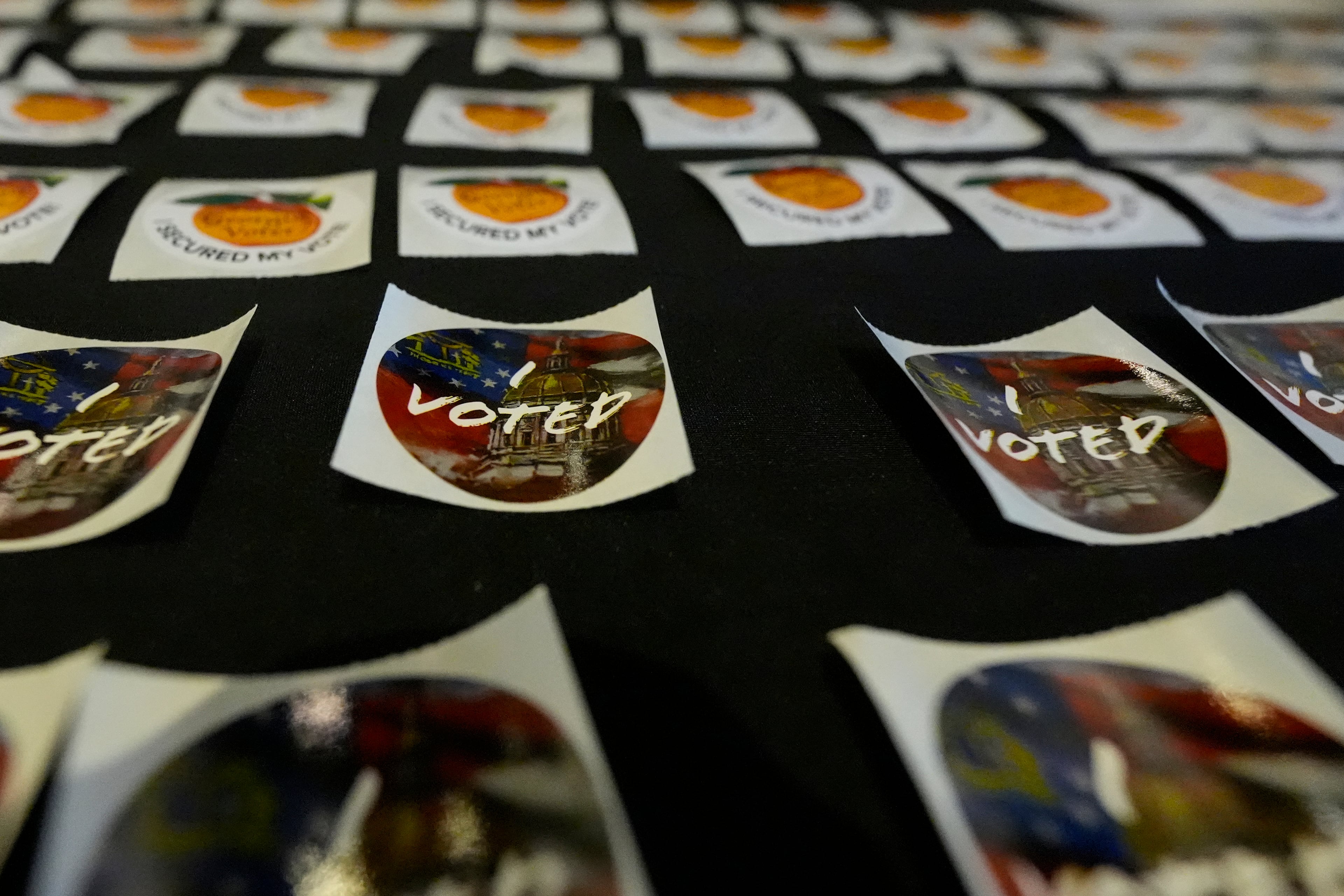 Stickers are seen at the Southwest Arts Center voting site in Atlanta on the first day for early voting in Georgia, Tuesday, Oct. 13, 2026. (Mike Stewart/AP)