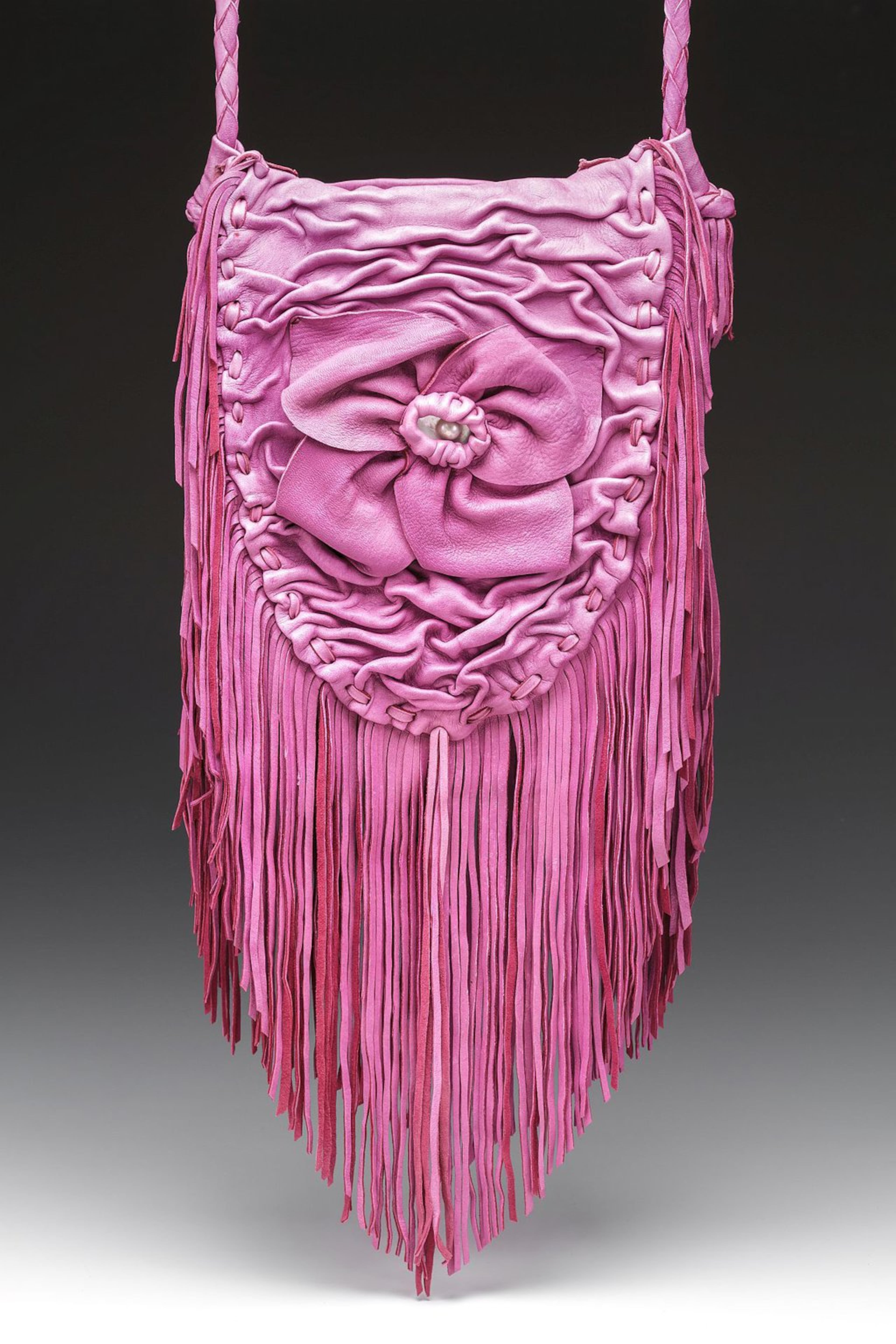 Knoxville’s Vicki Love uses deerskin in her leather bags and accessories. Though she offers a variety of colors, the raspberry sorbet is a signature color that her tannery developed for the longtime artist.