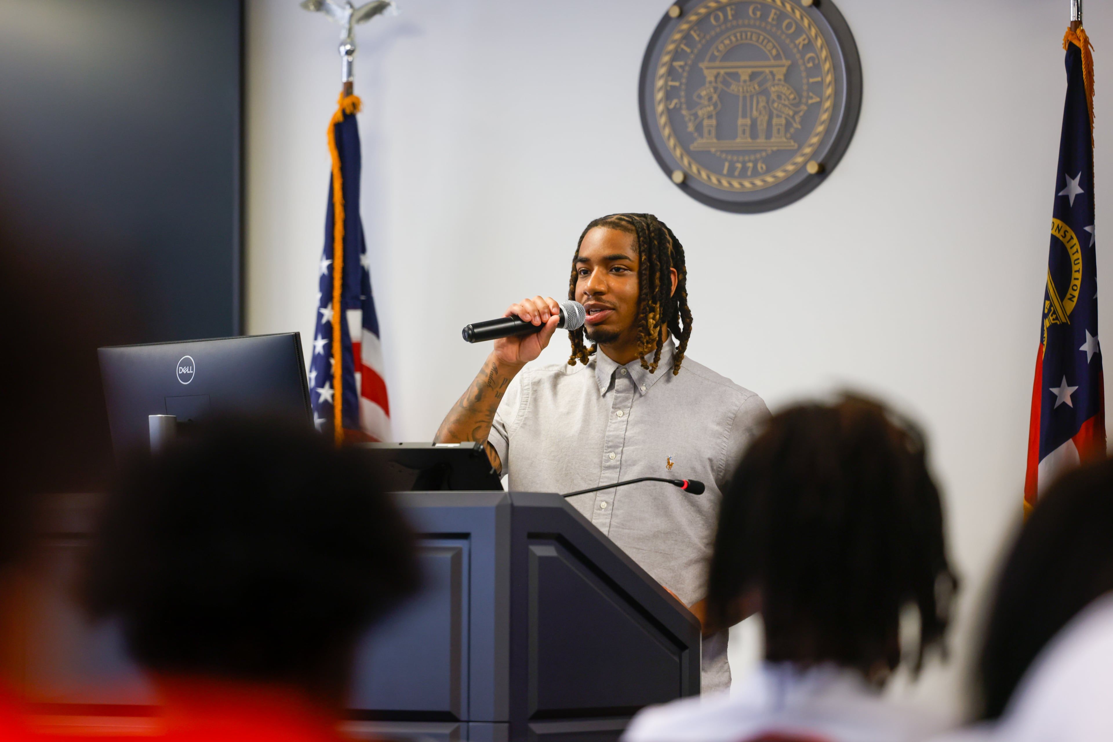 Amir Gilbert speaks during the graduation ceremony on Monday, Sept. 28, 2026. The STRIDE program gave him “the opportunity to want better for myself,” he said in his speech. (Arvin Temkar/AJC)
