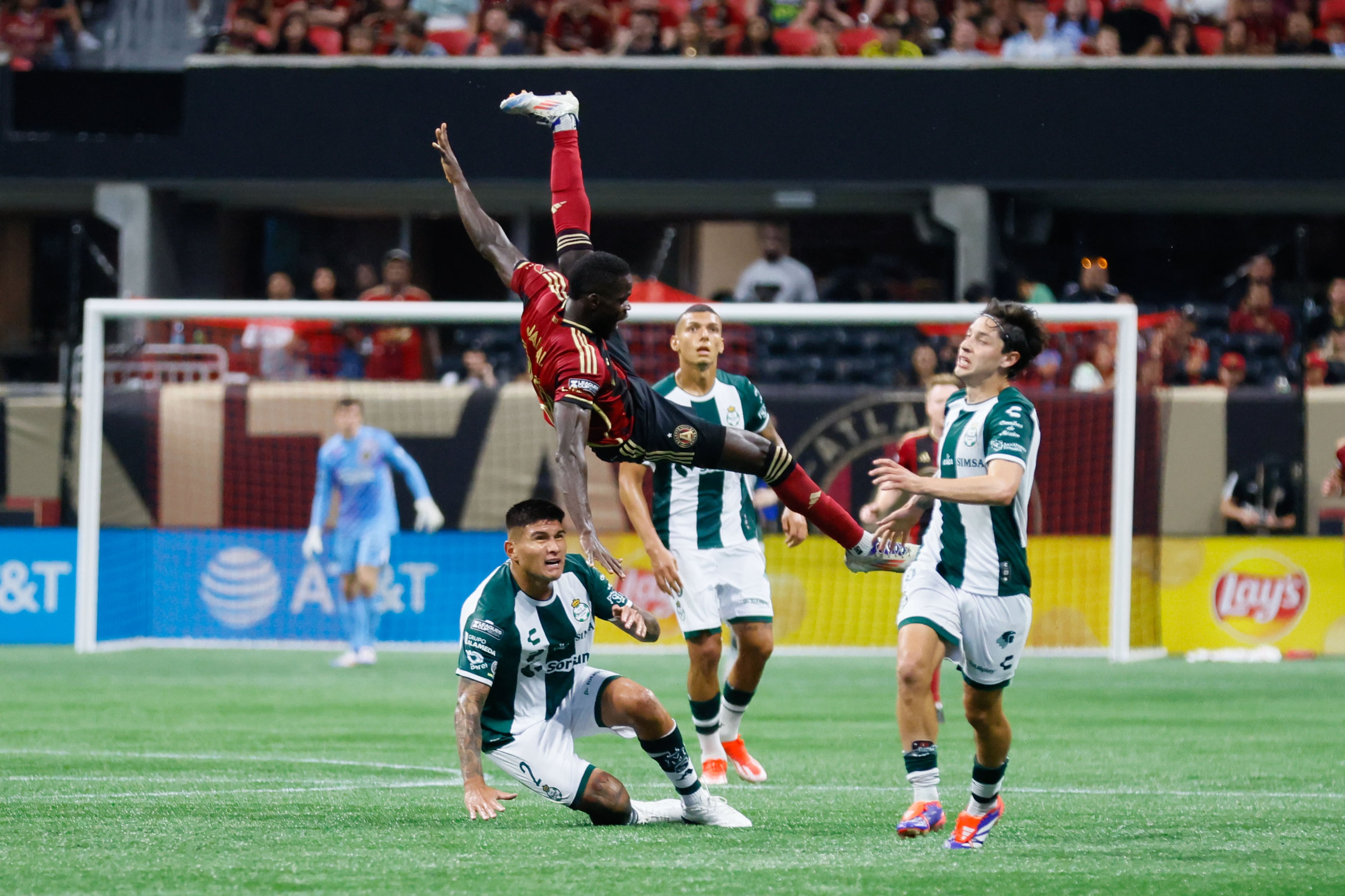 Atlanta United forward Jamal Thiare is fouled by Santos Laguna defender Bruno Agustin Amione during the second half of a Leagues Cup match at Mercedes-Benz Stadium on Sunday, Aug. 4, 2024, in Atlanta.
(Miguel Martinez/ AJC)