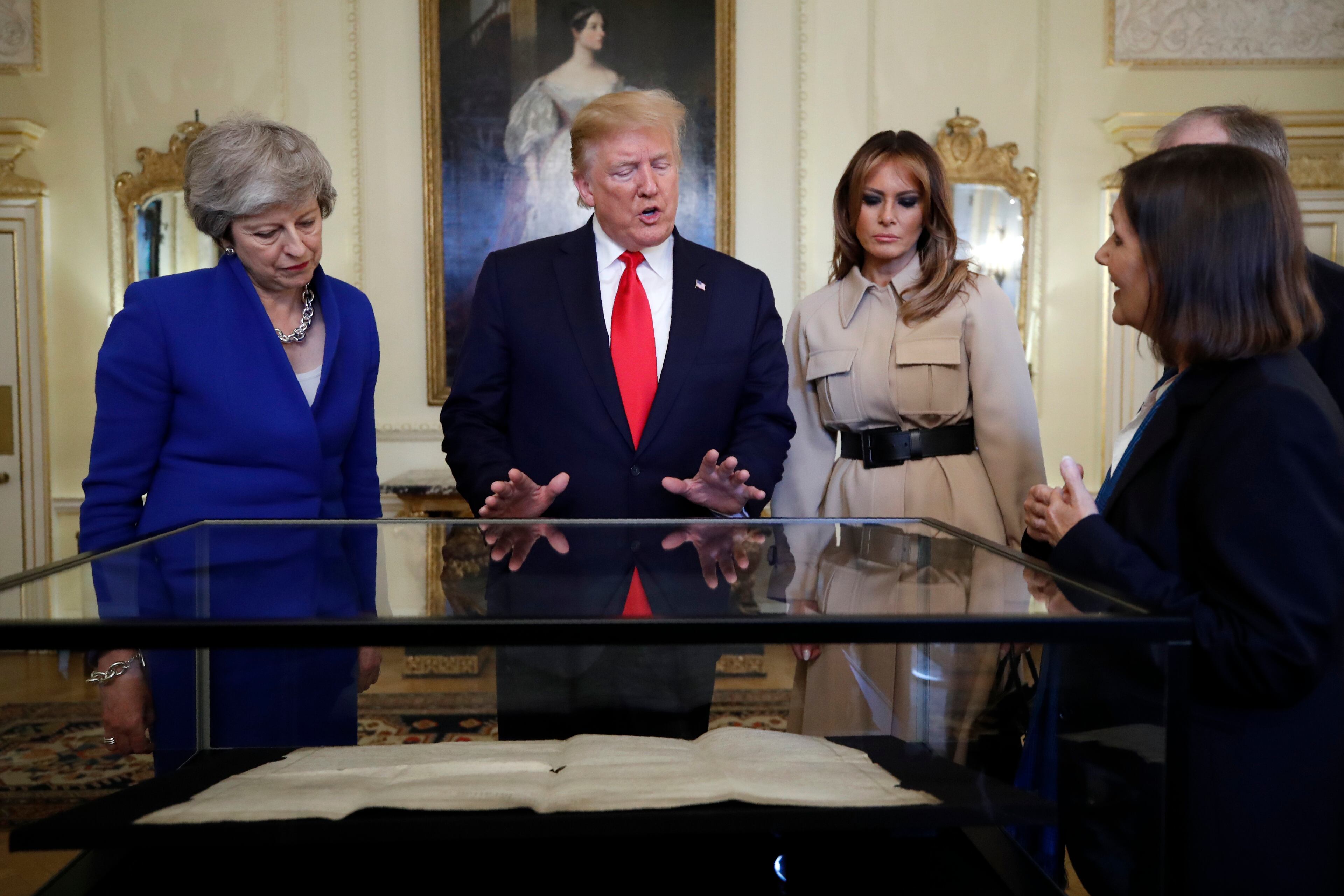 President Donald Trump, first lady Melania Trump, British Prime Minister Theresa May, left, and her husband Philip, right, view a copy of the United States Declaration of Independence, at 10 Downing Street, Tuesday, June 4, 2019, in London. (AP Photo/Alex Brandon)