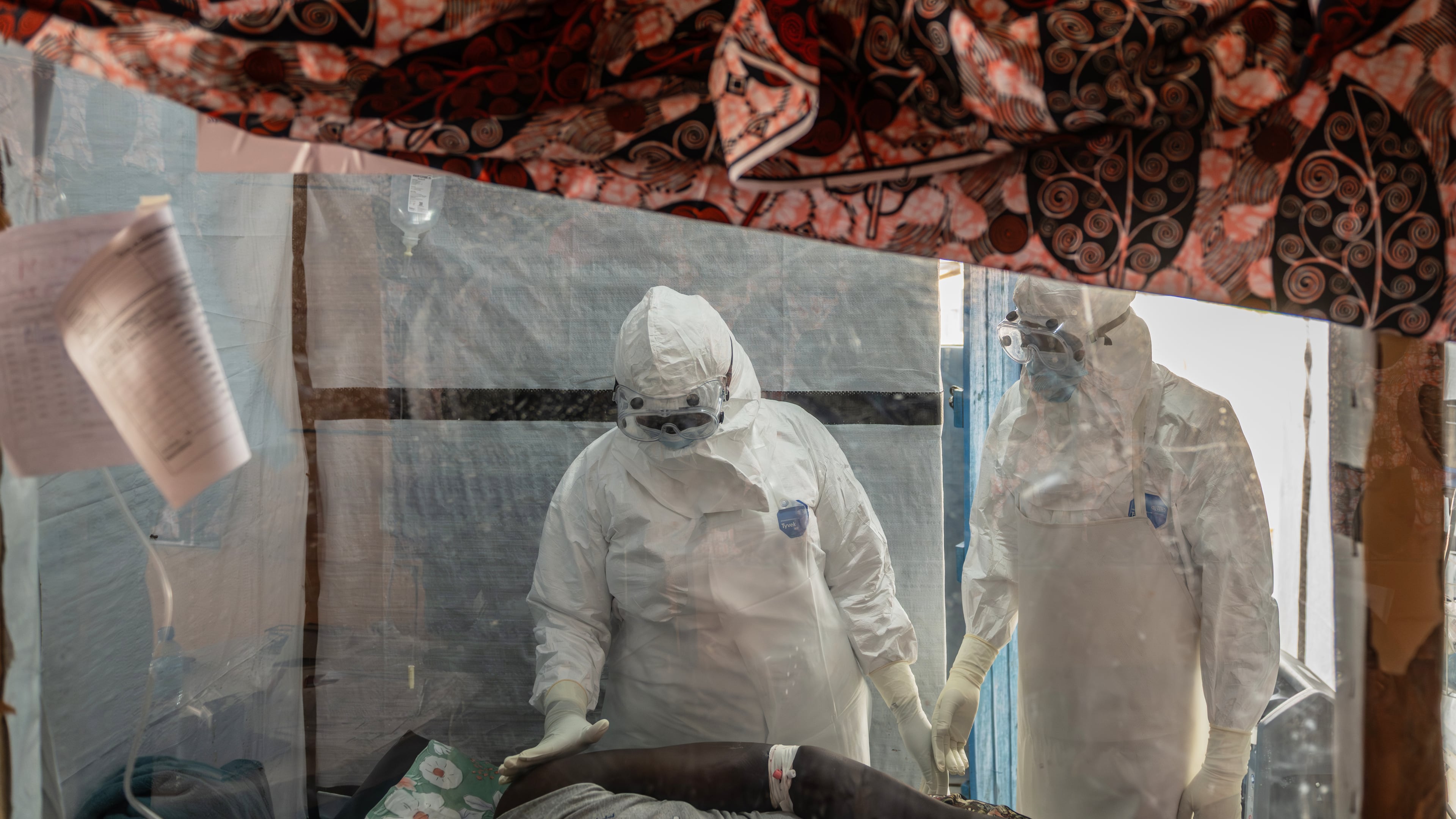 FILE - Health workers tend to an Ebola patient at the Rwampara Treatment Center in Ituri, Congo, Thursday, June 18, 2026. (AP Photo/Moses Sawasawa, file)