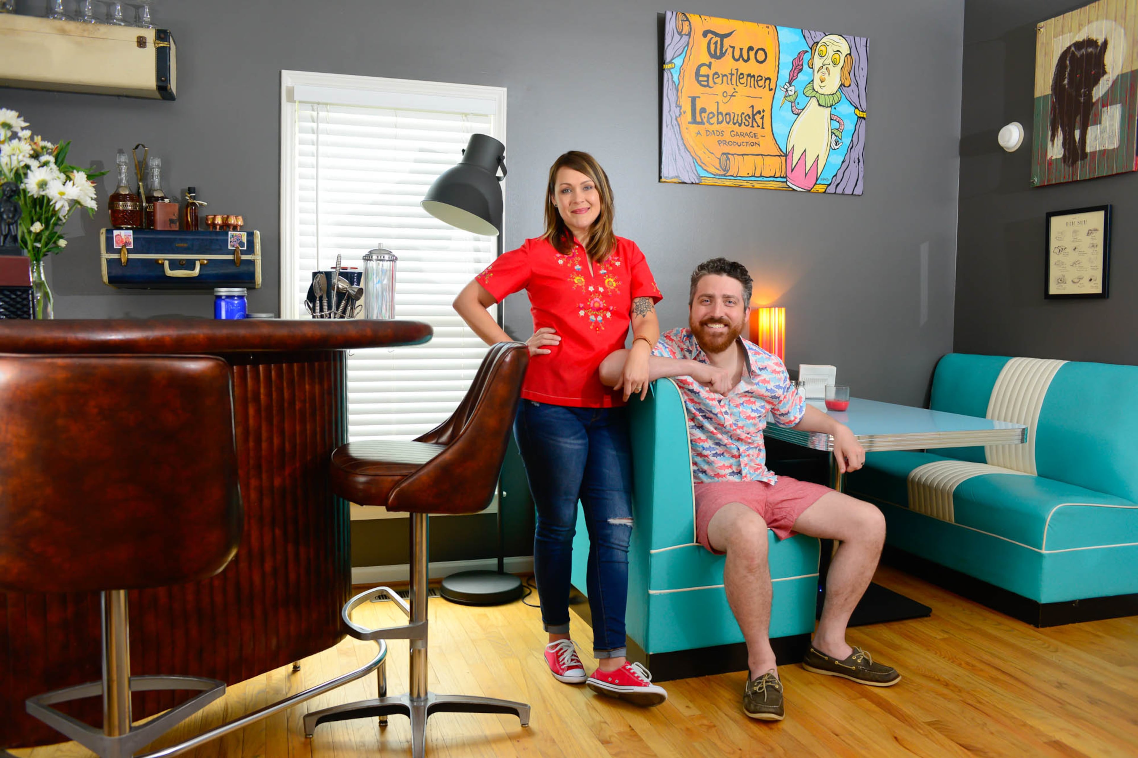 Quirky artwork, including the piece hanging above the booth in their dining area, fills the home of Amber Nash and Kevin Gillese in Atlanta's Cabbagetown neighborhood. The painting, by Atlanta artist R. Land, is from the first play Gillese directed, "Two Gentlemen of Lebowski," a Shakespearean retelling of "The Big Lebowski." The couple discovered the wolf image on found wood in a New Orleans shop.