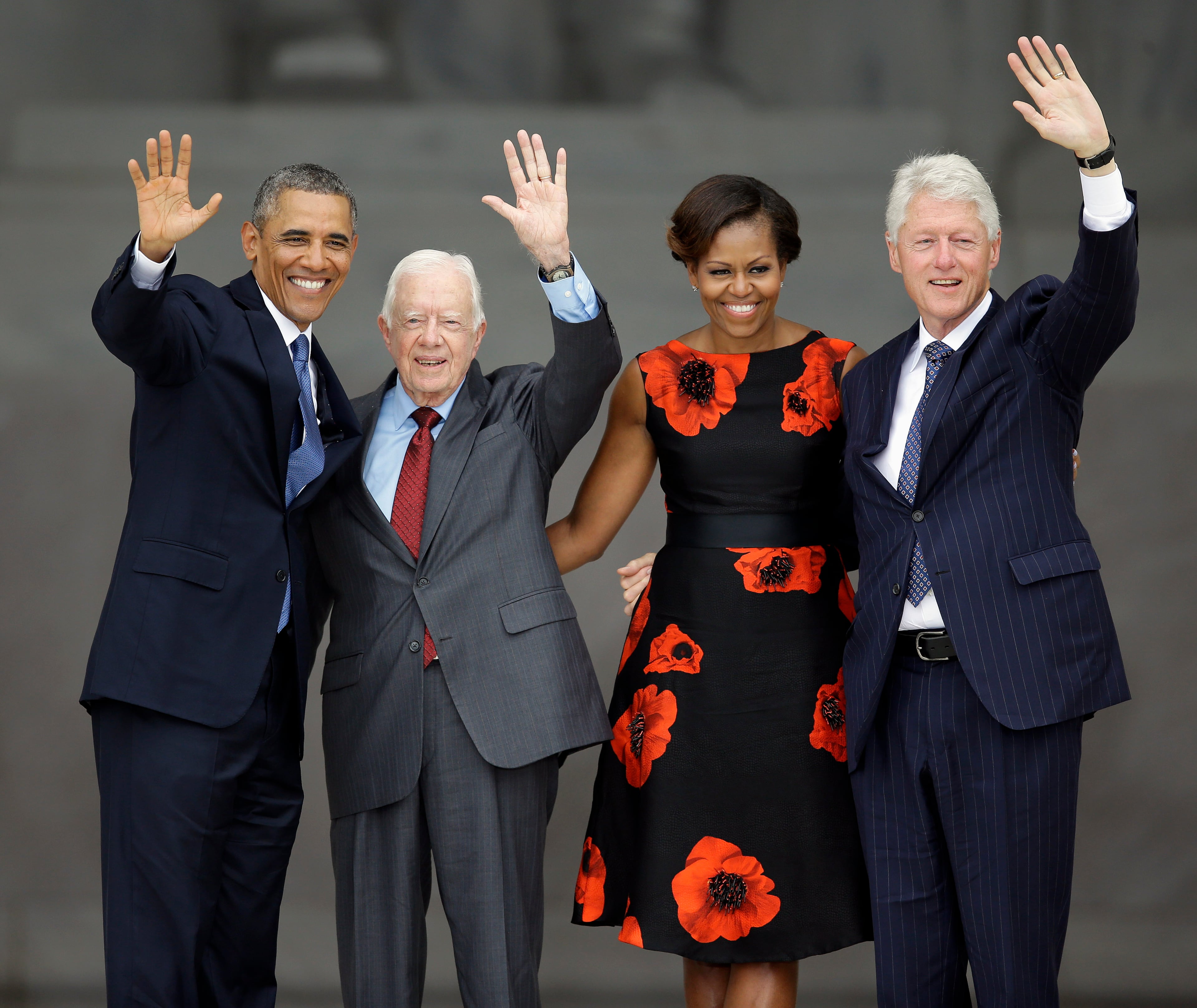 President Barack Obama, former President Jimmy Cater, first lady Michelle Obama and former President Bill Clinton wave at the end of the Let Freedom Ring ceremony at the Lincoln Memorial in Washington, Wednesday, Aug. 28, 2013, to commemorate the 50th anniversary of the 1963 March on Washington for Jobs and Freedom. It was 50 years ago today when Martin Luther King Jr. delivered his "I Have a Dream" speech from the steps of the memorial. (AP Photo/Carolyn Kaster)