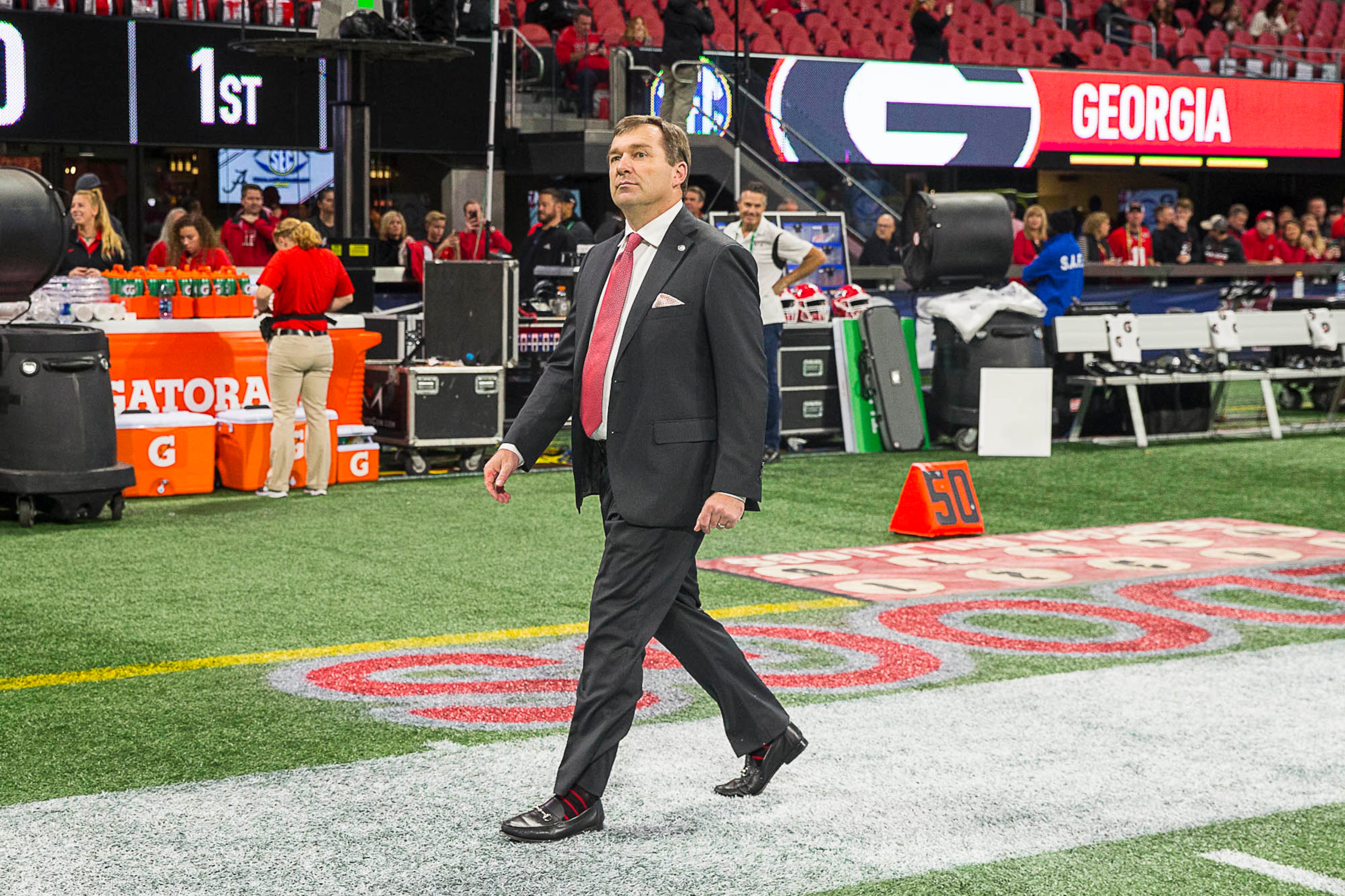 12/01/2018 -- Atlanta, Georgia -- Georgia Bulldogs head coach Kirby Smart walks the field before the start of the SEC Championship game at the Mercedes-Benz Stadium in Atlanta, Saturday, December 1, 2018. Georgia will play Alabama for the title. (ALYSSA POINTER/ALYSSA.POINTER@AJC.COM)