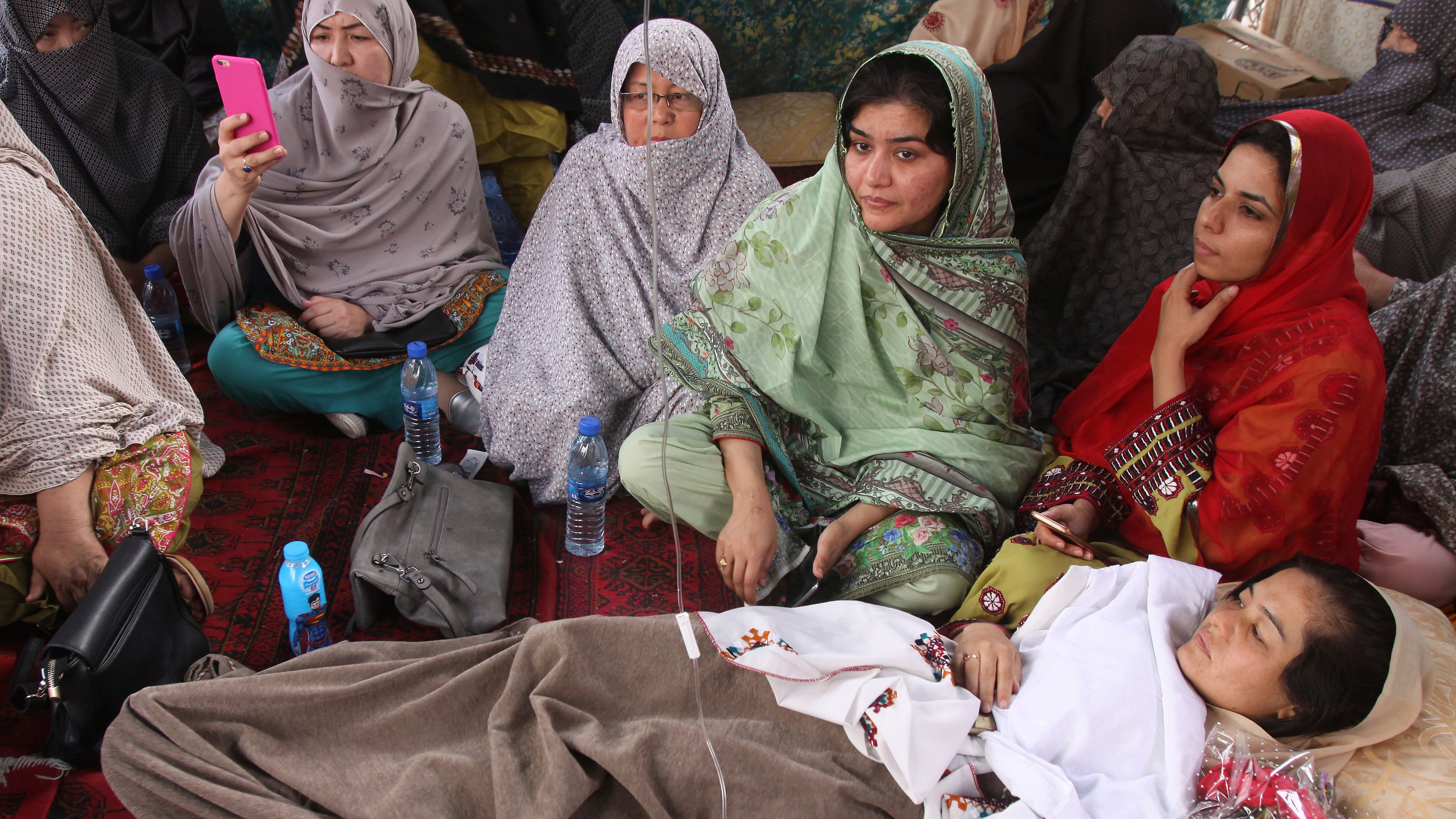 FILE — In this May 1, 2018 photo, Pakistani lawyer Jalila Haider, who is on a hunger strike, rests at a camp in Quetta, Pakistan. (AP Photo/Arshad Butt, File)