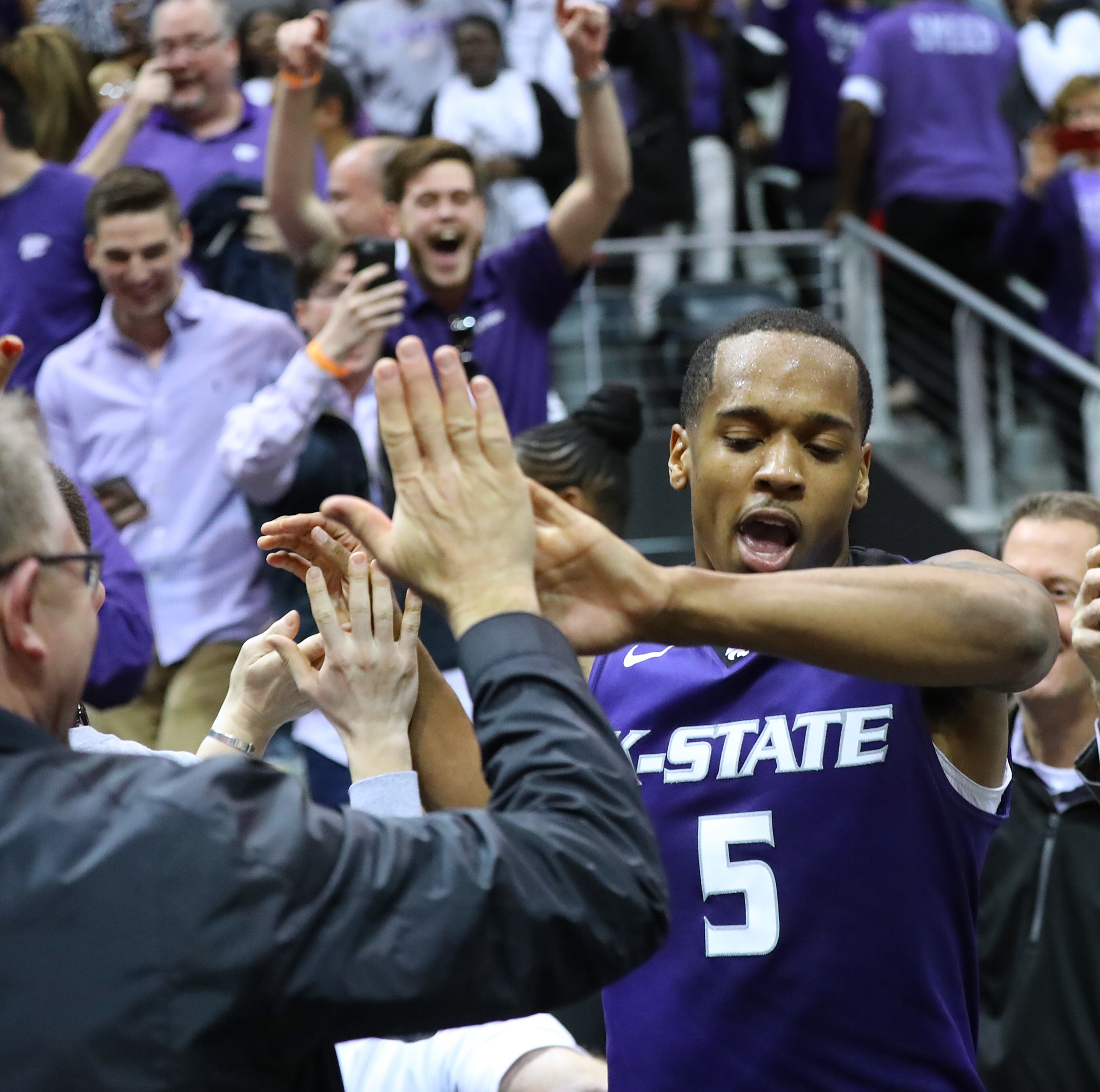 March 23, 2018 Atlanta: Kansas State guard Barry Brown, Jr., goes into the crowd to celebrate with fans after beating Kentucky 61-58 in a regional semifinal NCAA college basketball game on Friday, March 23, 2018, in Atlanta. Curtis Compton/ccompton@ajc.com