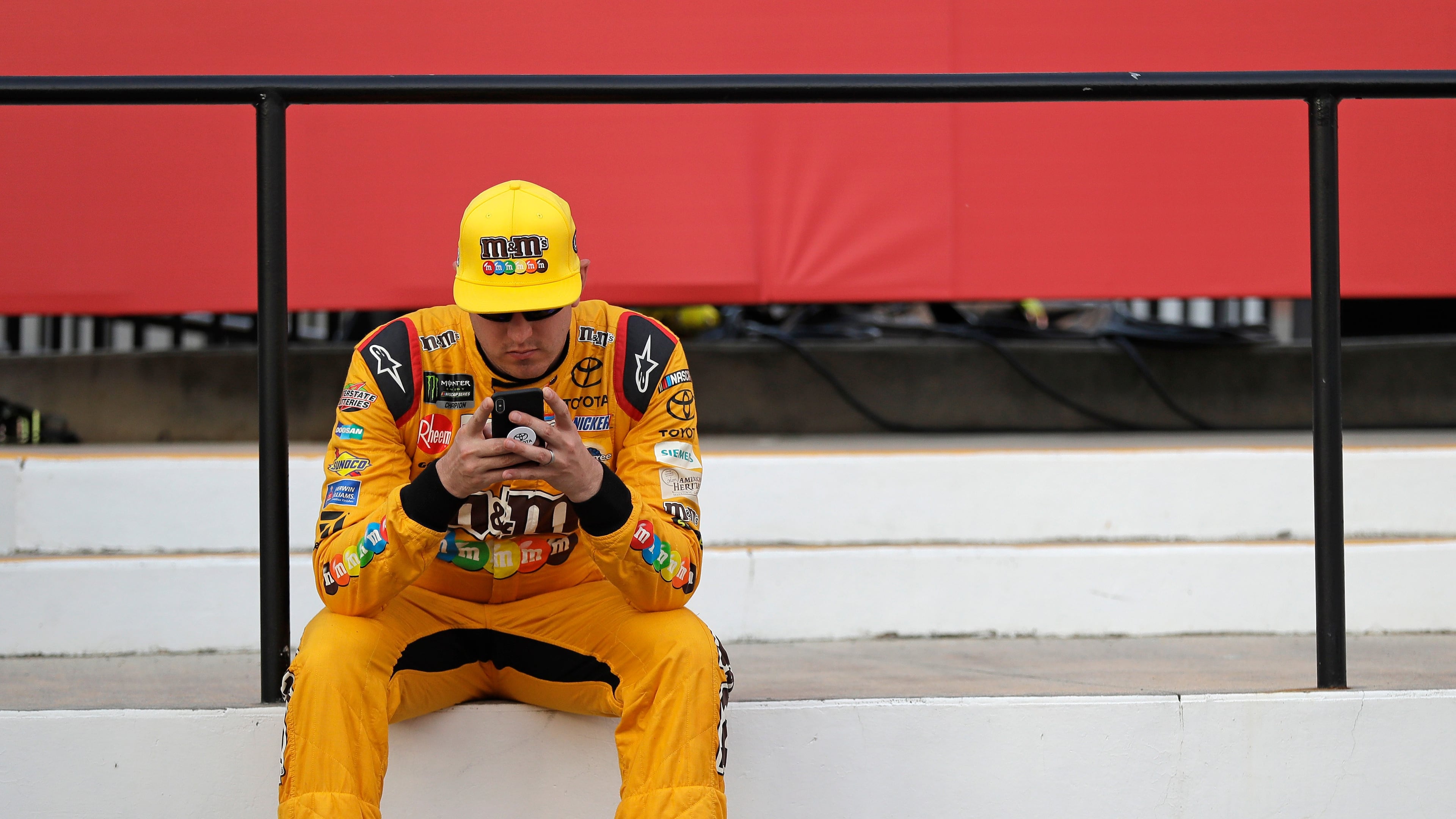 FILE - Kyle Busch waits in Victory Lane after winning the pole position for the NASCAR Cup series auto race at Charlotte Motor Speedway in Charlotte, N.C., Thursday, May 24, 2018. (AP Photo/Chuck Burton, File)