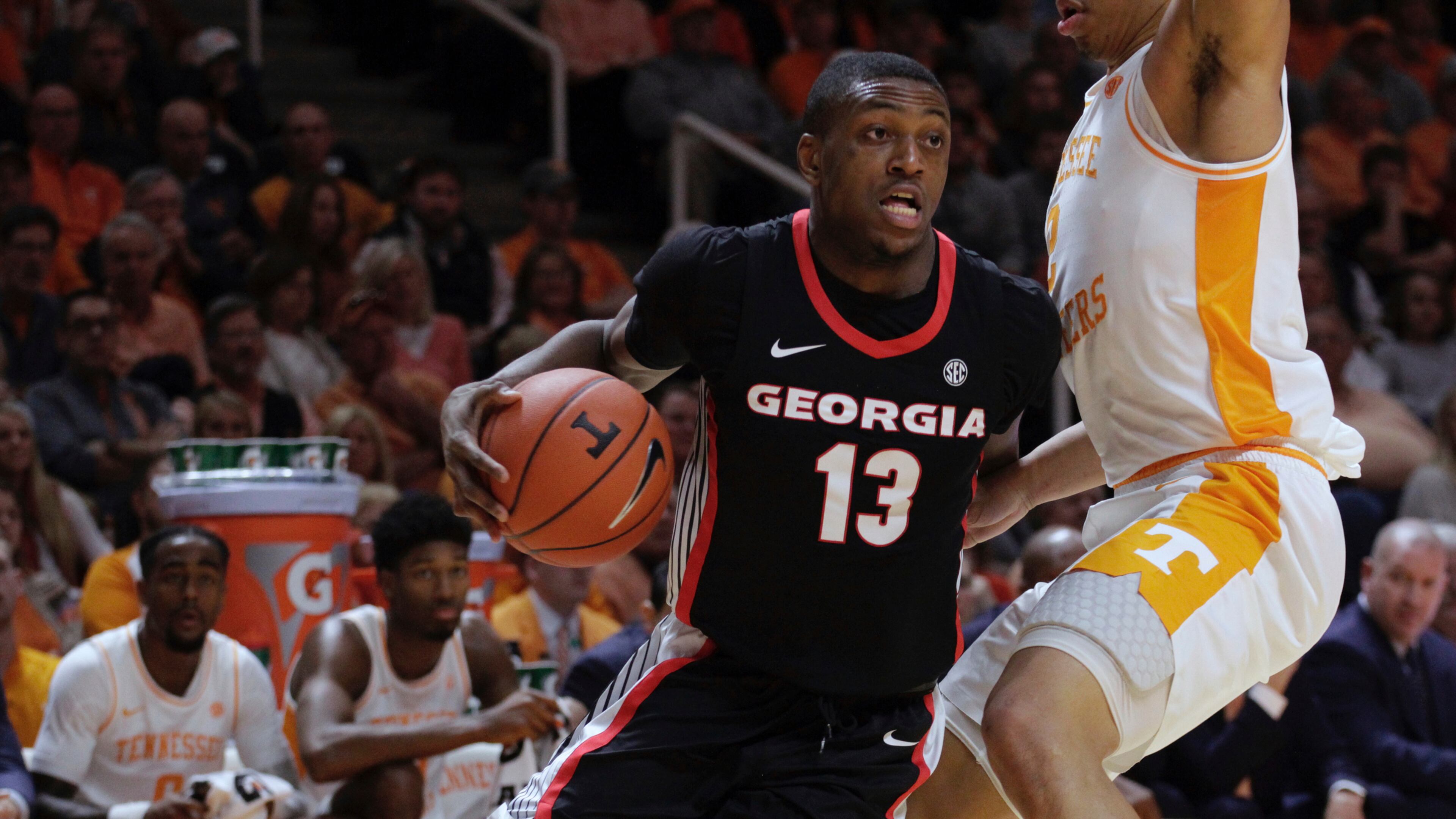 Georgia forward E'Torrion Wilridge (13) drives the ball against Tennessee forward Grant Williams (2) in the first half of an NCAA college basketball game Saturday, Jan. 5, 2019, in Knoxville, Tenn. (AP Photo/Shawn Millsaps)