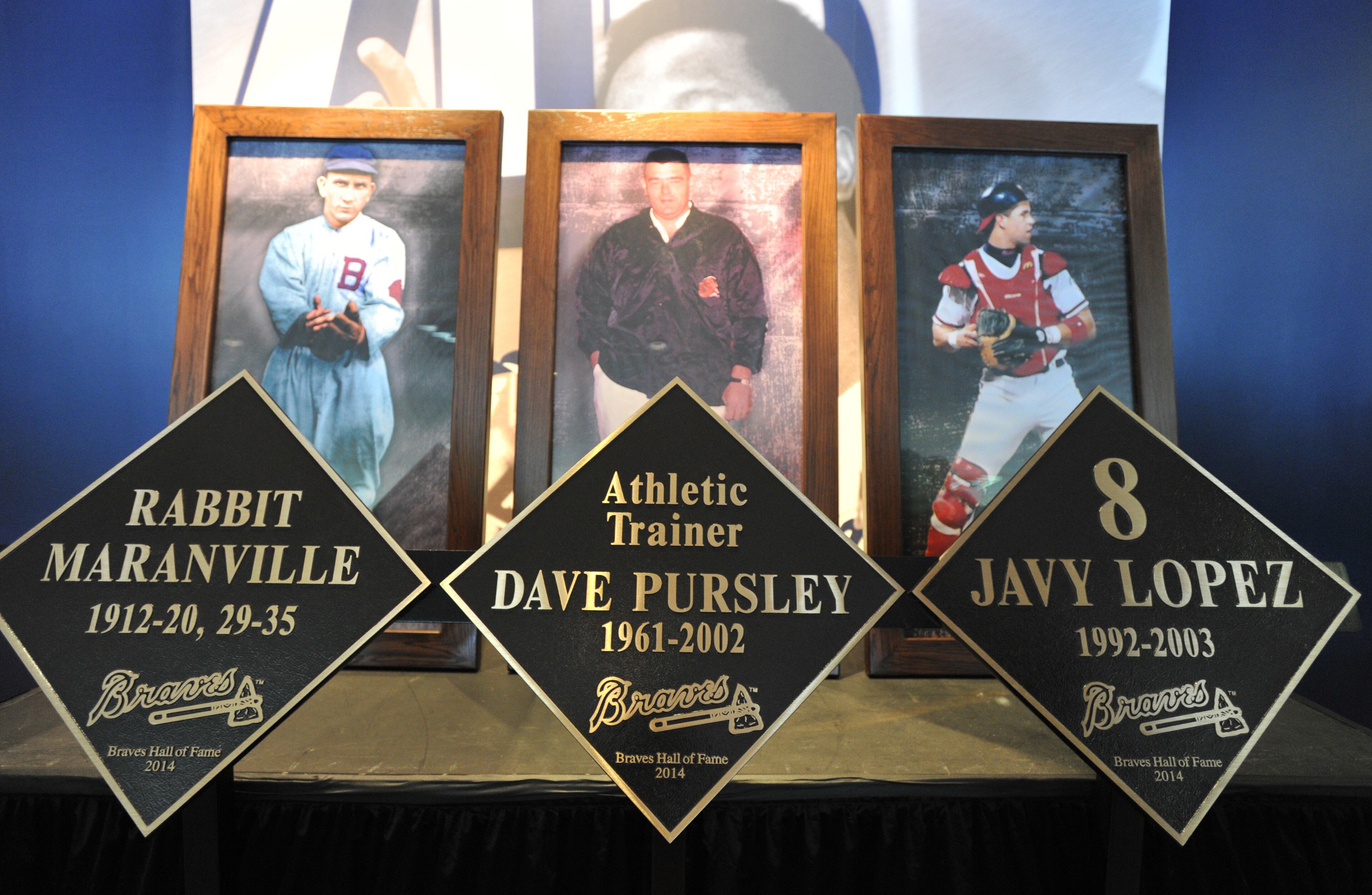 Portraits of 2014 Braves Hall of Famers are displayed during the luncheon.