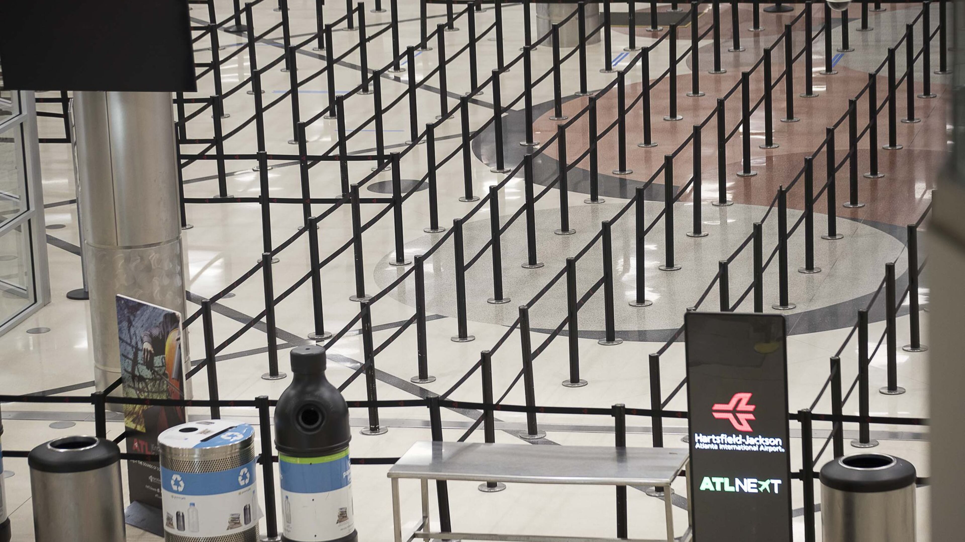There are no lines at the main security checkpoint inside the domestic terminal at Hartsfield-Jackson International Airport in Atlanta, Tuesday, April 14, 2020. (ALYSSA POINTER / ALYSSA.POINTER@AJC.COM)
