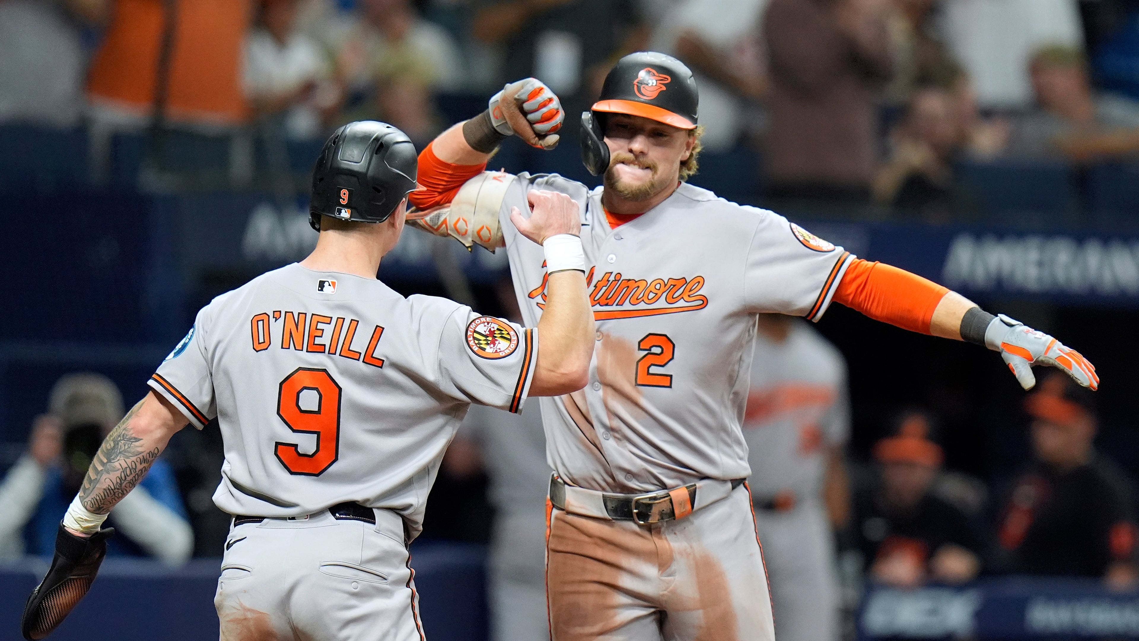 Baltimore Orioles' Gunnar Henderson (2) celebrates his two-run home run off Tampa Bay Rays pitcher Chris Roycroft with Tyler O'Neill (9) during the eighth inning of a baseball game Friday, Aug. 14, 2026, in St. Petersburg, Fla. (AP Photo/Chris O'Meara)