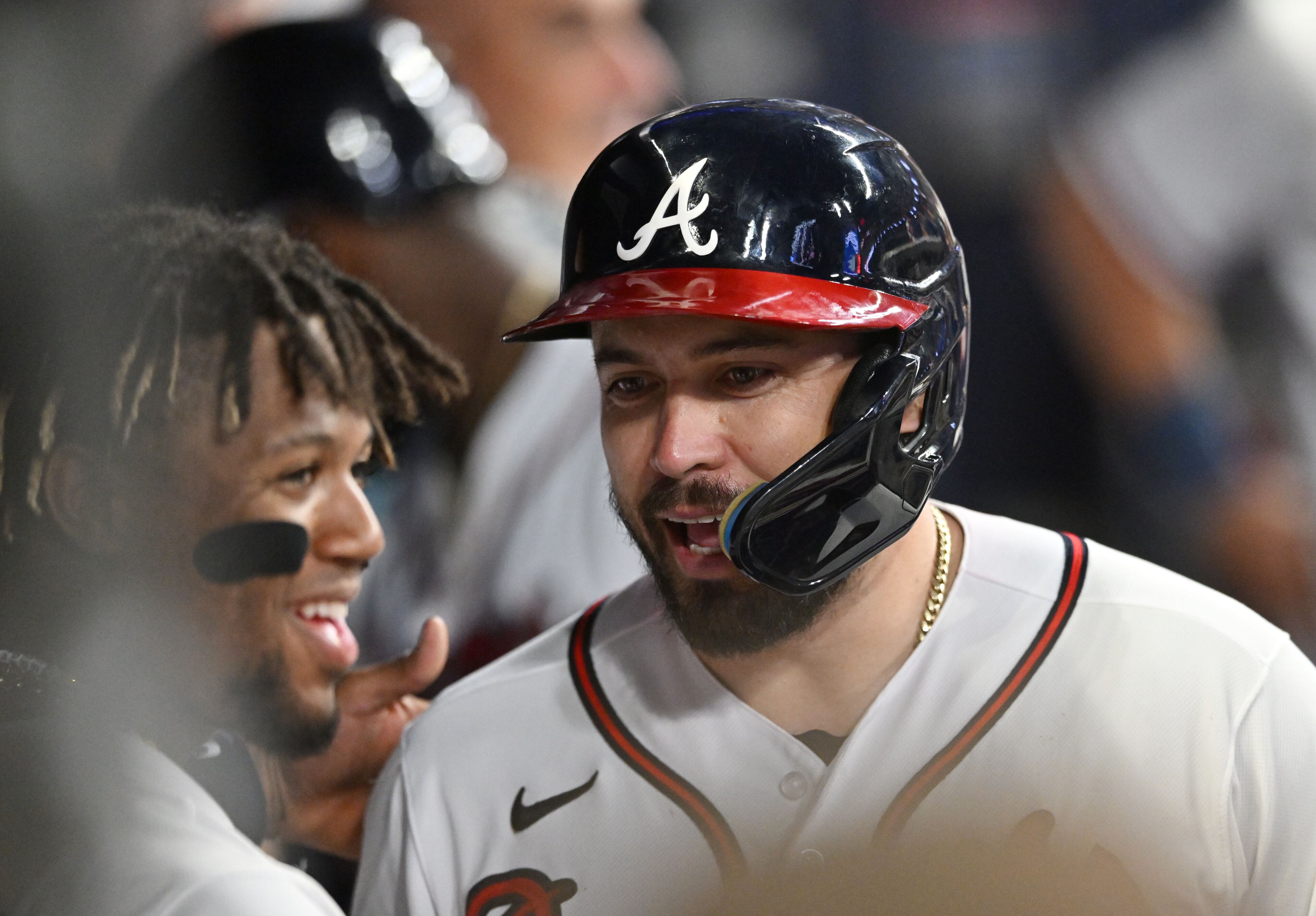 Atlanta Braves' catcher Travis d'Arnaud (16) celebrates with teammates after hitting a 2-run home run during the seventh inning at Truist Park. (Hyosub Shin / Hyosub.Shin@ajc.com)