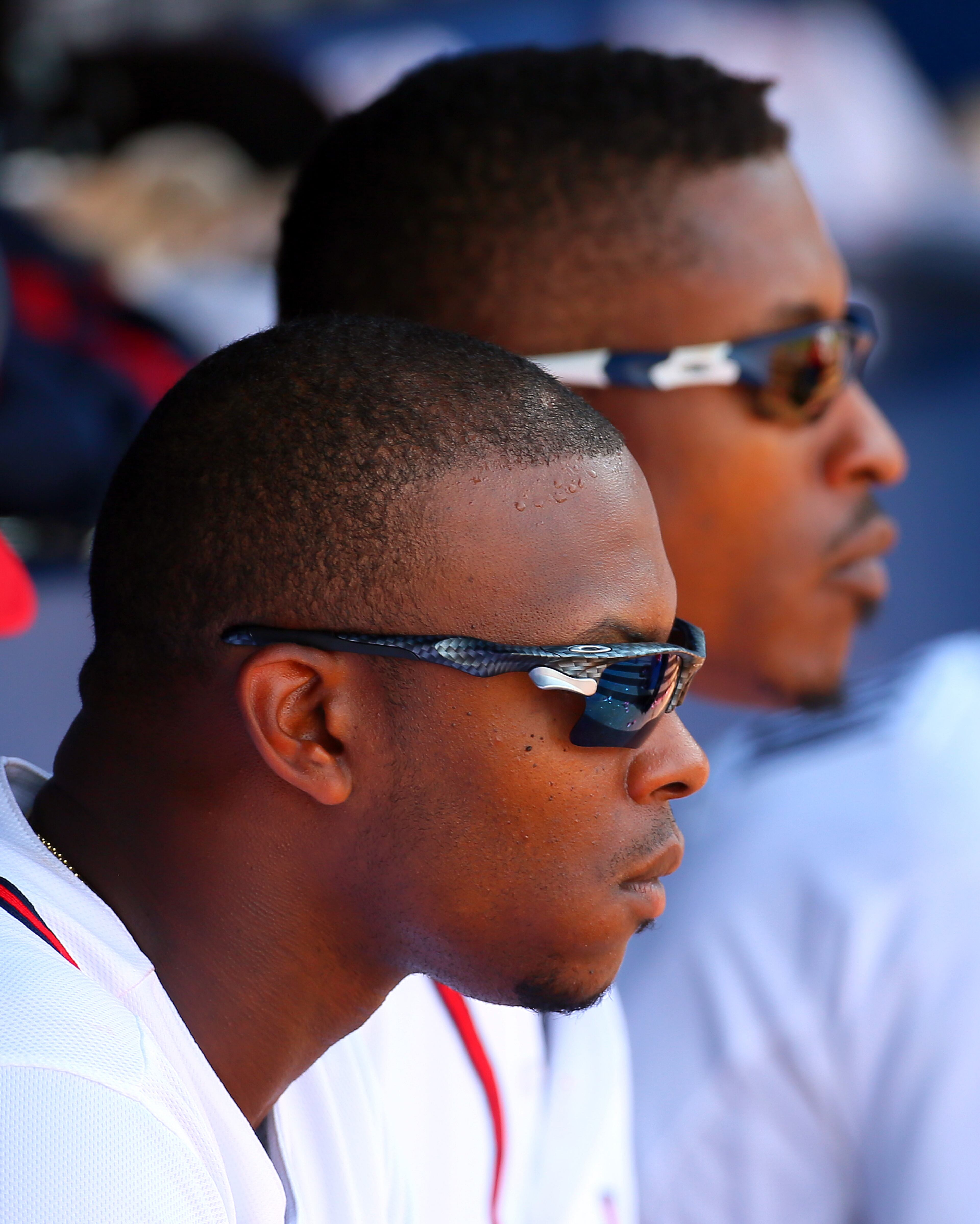 The Upton brothers Justin (front) and B.J. (back) watch the game from the dugout during the eight inning against the Mets in a MLB baseball game on Wednesday, Sept. 4, 2013, in Atlanta.