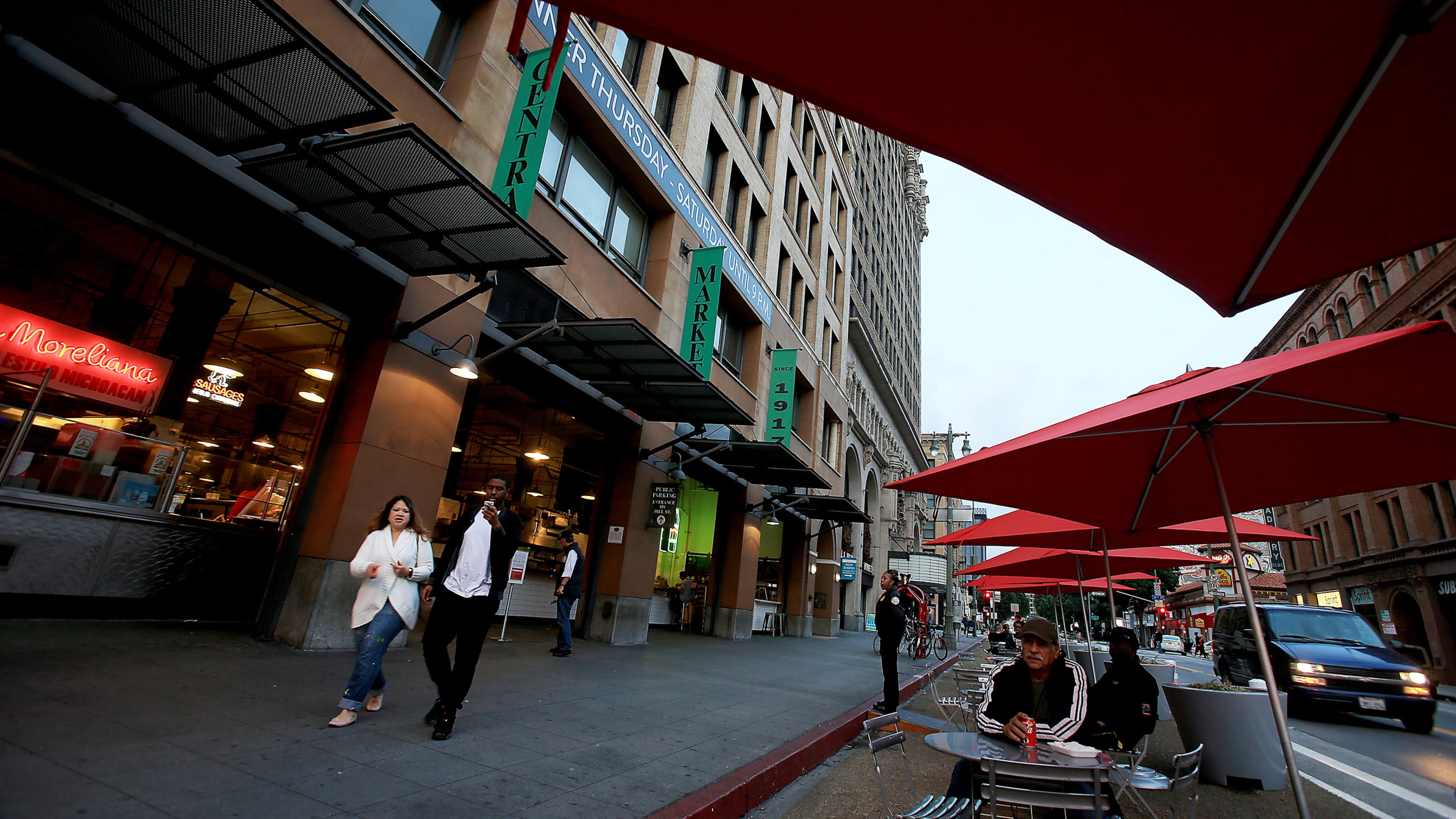 Umbrellas and chairs for dining along Broadway in front of the Grand Central Market in downtown Los Angeles. (Luis Sinco/Los Angeles Times/TNS)