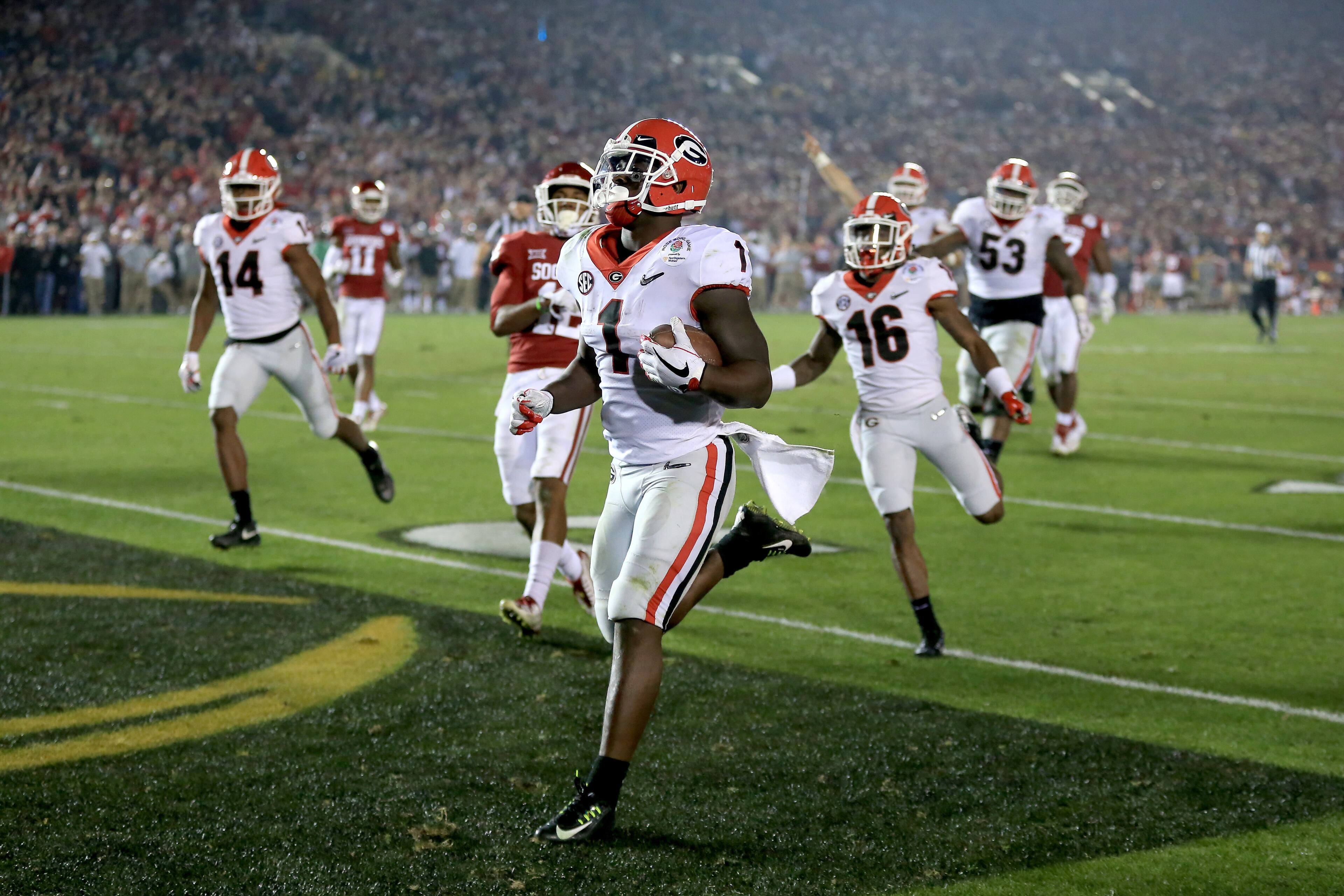 PASADENA, CA - JANUARY 01: Sony Michel #1 of the Georgia Bulldogs scores the winning touchdown in the 2018 College Football Playoff Semifinal Game against the Oklahoma Sooners at the Rose Bowl Game presented by Northwestern Mutual at the Rose Bowl on January 1, 2018 in Pasadena, California. (Photo by Sean M. Haffey/Getty Images)