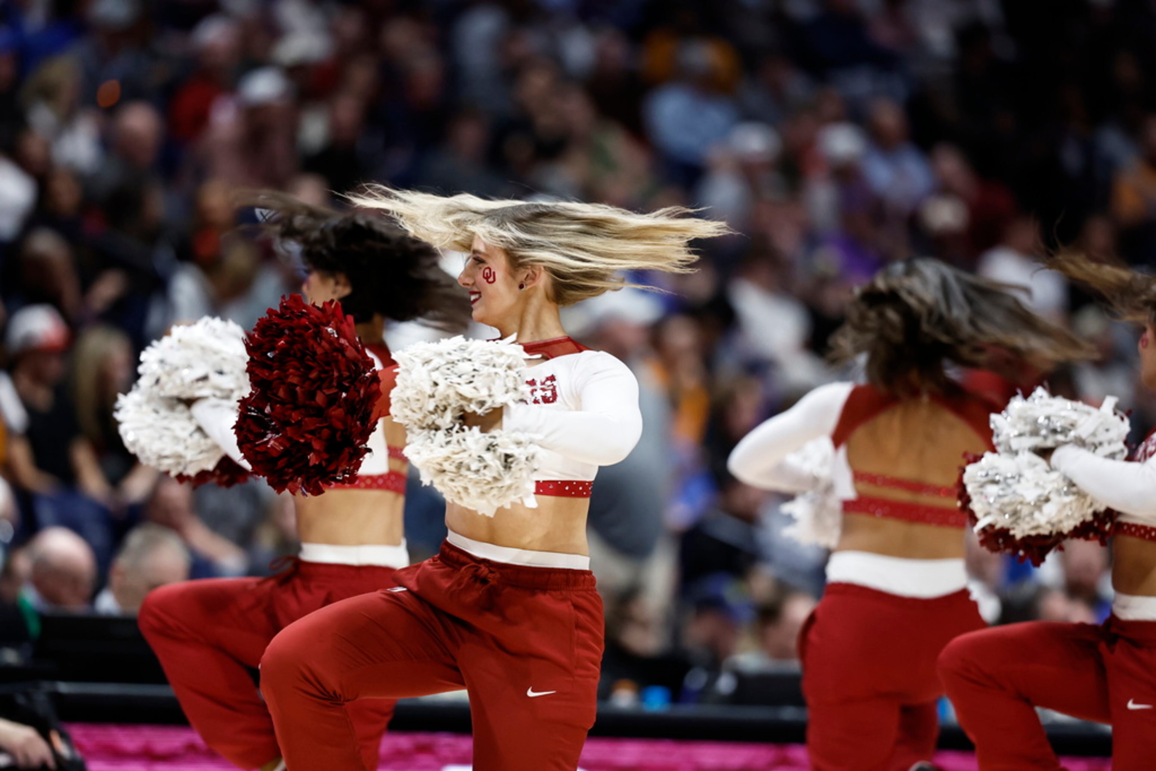 Oklahoma cheerleaders perform during the first half of an NCAA college basketball game against Georgia at the Southeastern Conference tournament, Wednesday, March 12, 2025, in Nashville, Tenn. (AP Photo/Wade Payne)