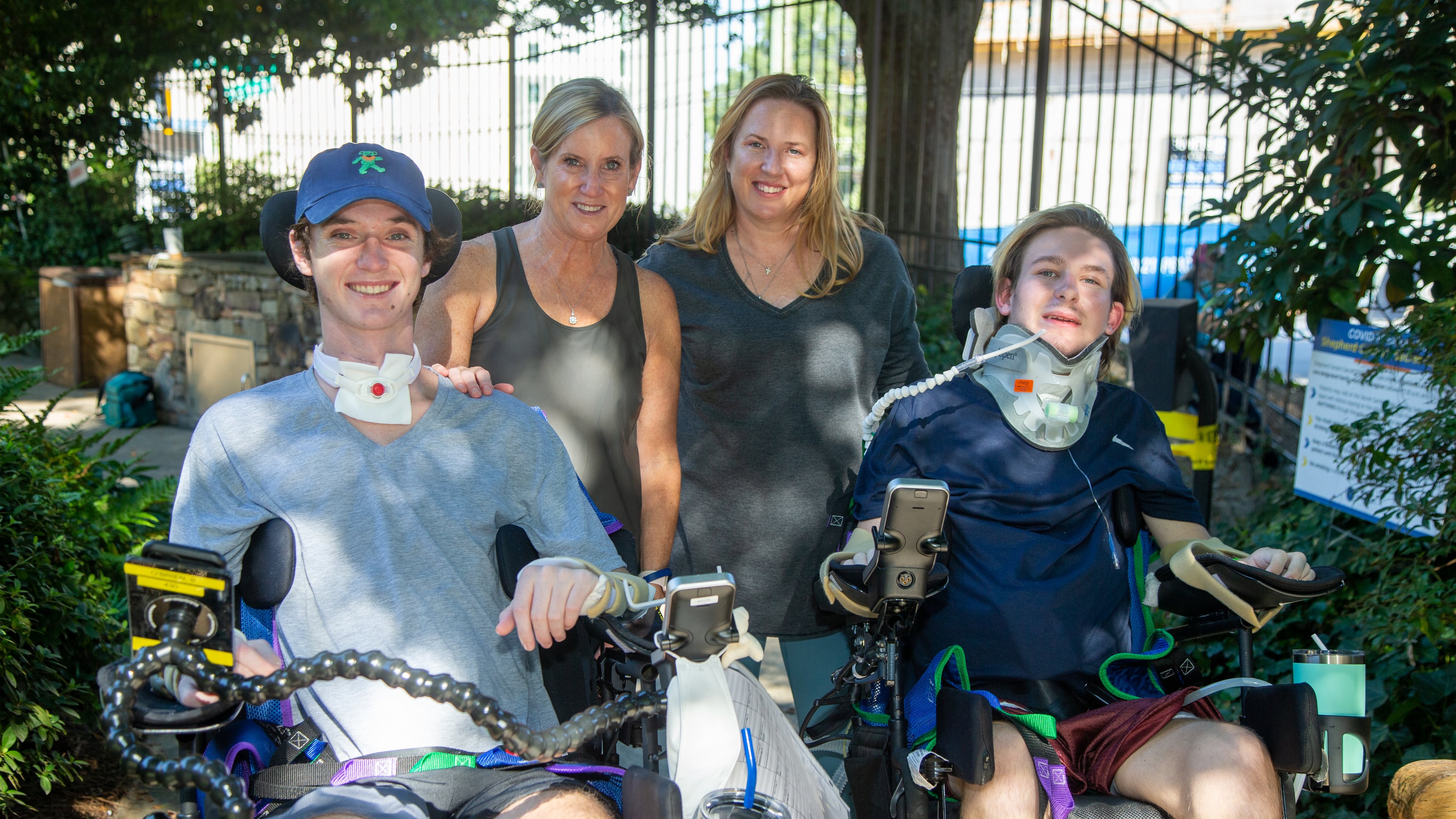 (left to right) Britt O'Brien, his mother Kristen, Jennifer Stanford & her son Julian in The Shepherd Center secret garden. The two mothers met at the center where their boys are patients. Both boys are currently paralyzed due to recent accidents. Due to COVID, the situation has been made extra difficult- no guests, only one parent, etc. The two women met in the halls and have formed an unlikely friendship in the midst of the unfathomable. PHIL SKINNER FOR THE ATLANTA JOURNAL-CONSTITUTION.