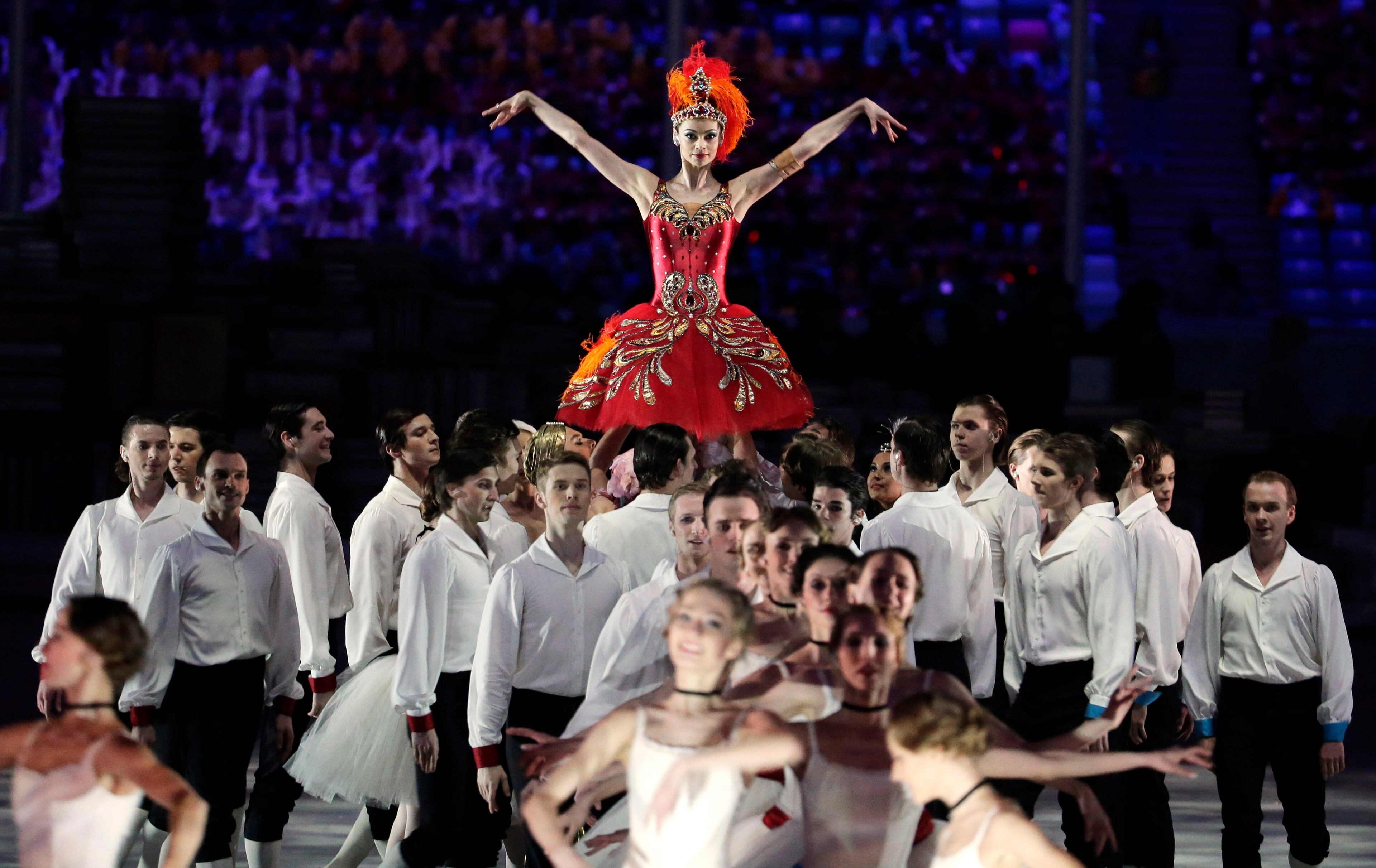 Performers dance during the closing ceremony of the 2014 Winter Olympics, Sunday, Feb. 23, 2014, in Sochi, Russia. (AP Photo/Charlie Riedel)