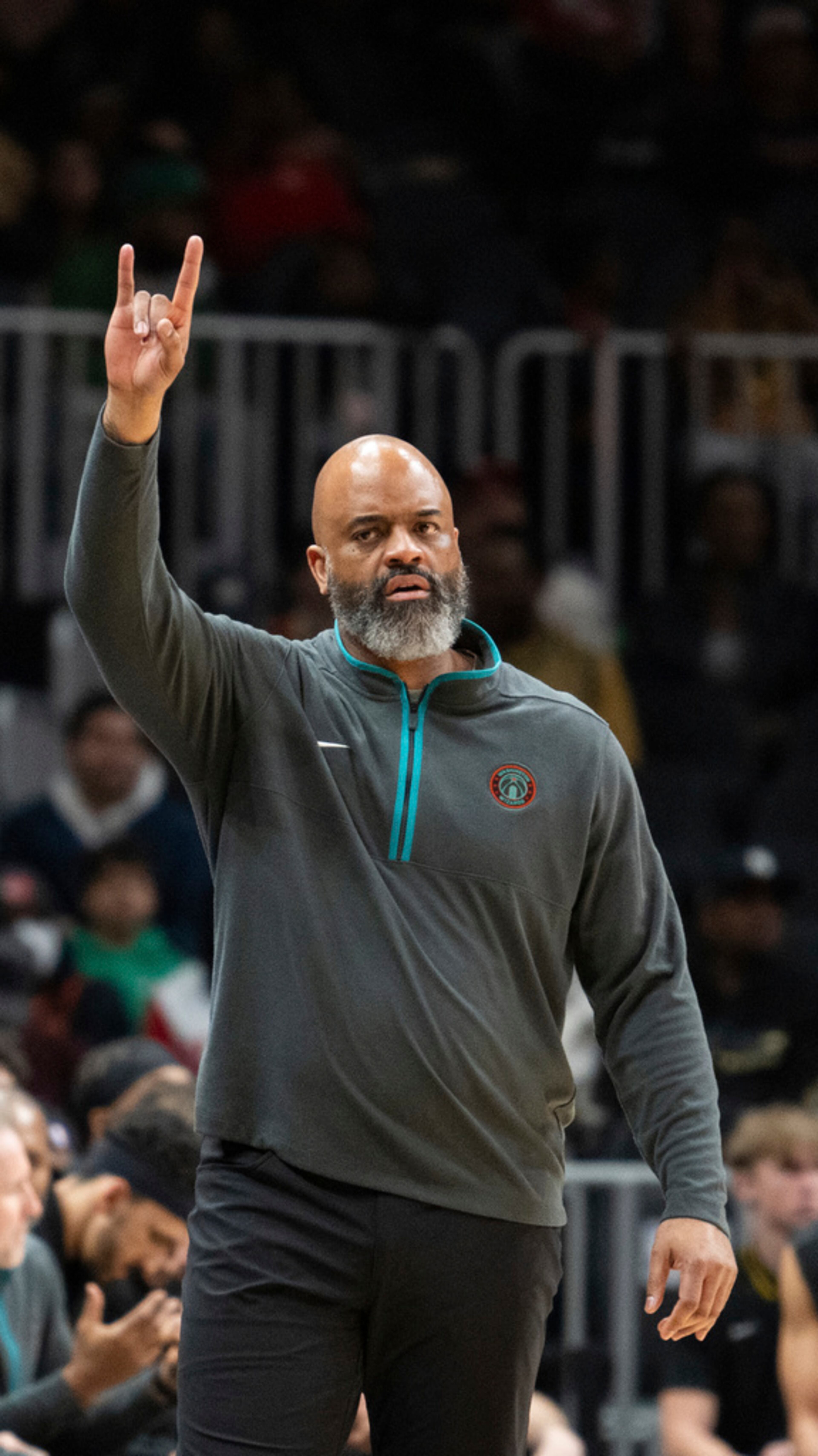 Washington Wizards head coach Wes Unseld Jr. signals for a play during the first half of an NBA basketball game against the Atlanta Hawks, Saturday, Jan 13, 2024, in Atlanta. (AP Photo/Hakim Wright Sr.)