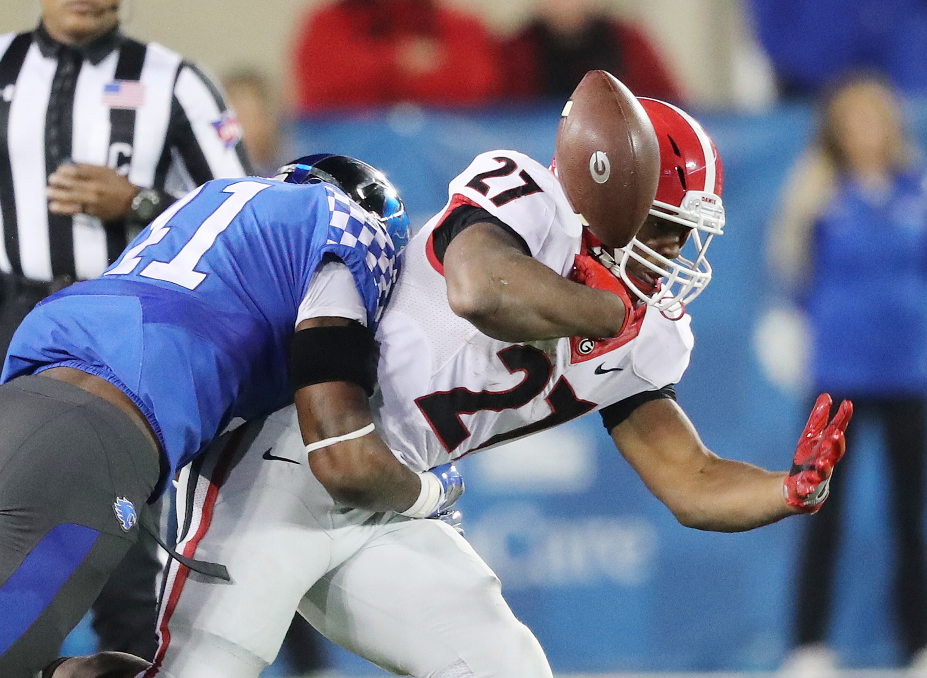 November 5, 2016, LEXINGTON: Georgia tailback Nick Chubb fumbles as he is hit by Kentucky linebacker Josh Allen during the third quarter of an NCAA college football game on Saturday, Nov. 5, 2016, in Lexington. Kentucky recovered the fumble. Curtis Compton /ccompton@ajc.com