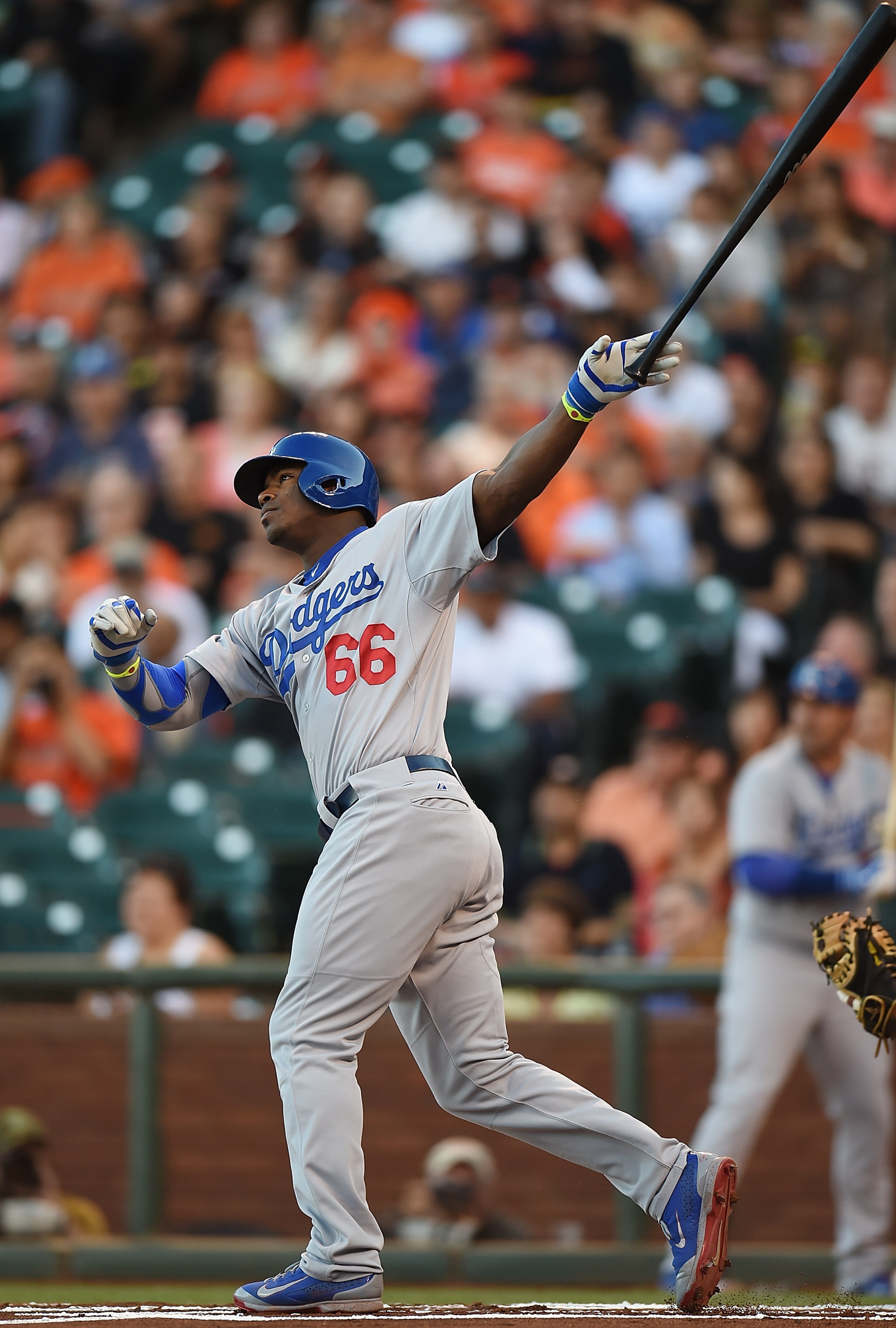 SAN FRANCISCO, CA - JULY 25: Yasiel Puig #66 of the Los Angeles Dodgers swings and watches the flight of his ball as he hits a triple in the top of the first inning against the San Francisco Giants at AT&T Park on July 25, 2014 in San Francisco, California. (Photo by Thearon W. Henderson/Getty Images)