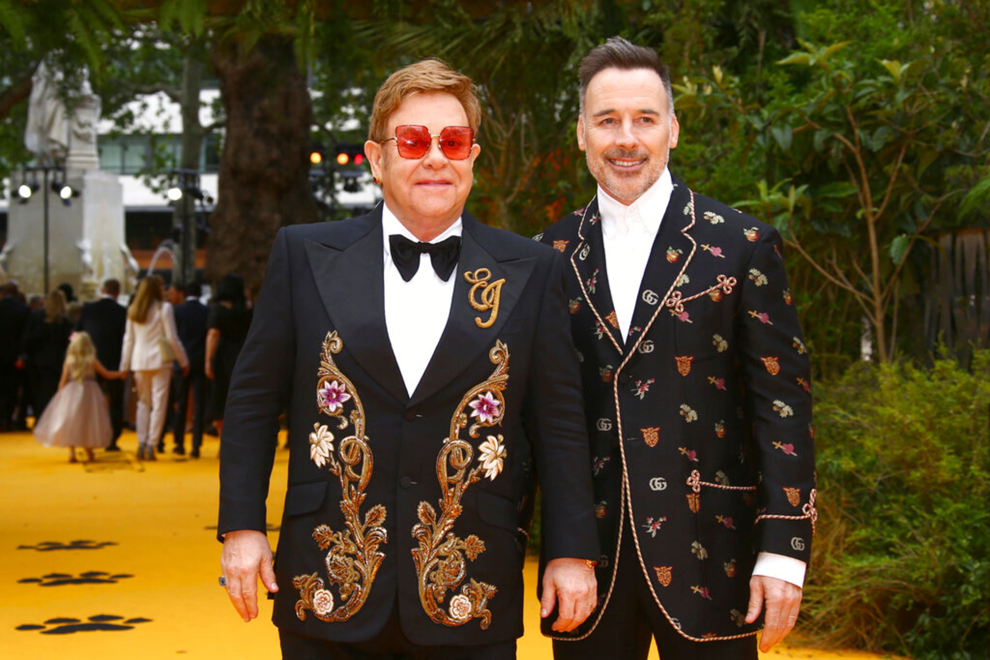 Singer Elton John, left, and David Furnish pose for photographers upon arrival at the 'Lion King' European premiere in central London, Sunday, July 14, 2019. (Photo by Joel C Ryan/Invision/AP)