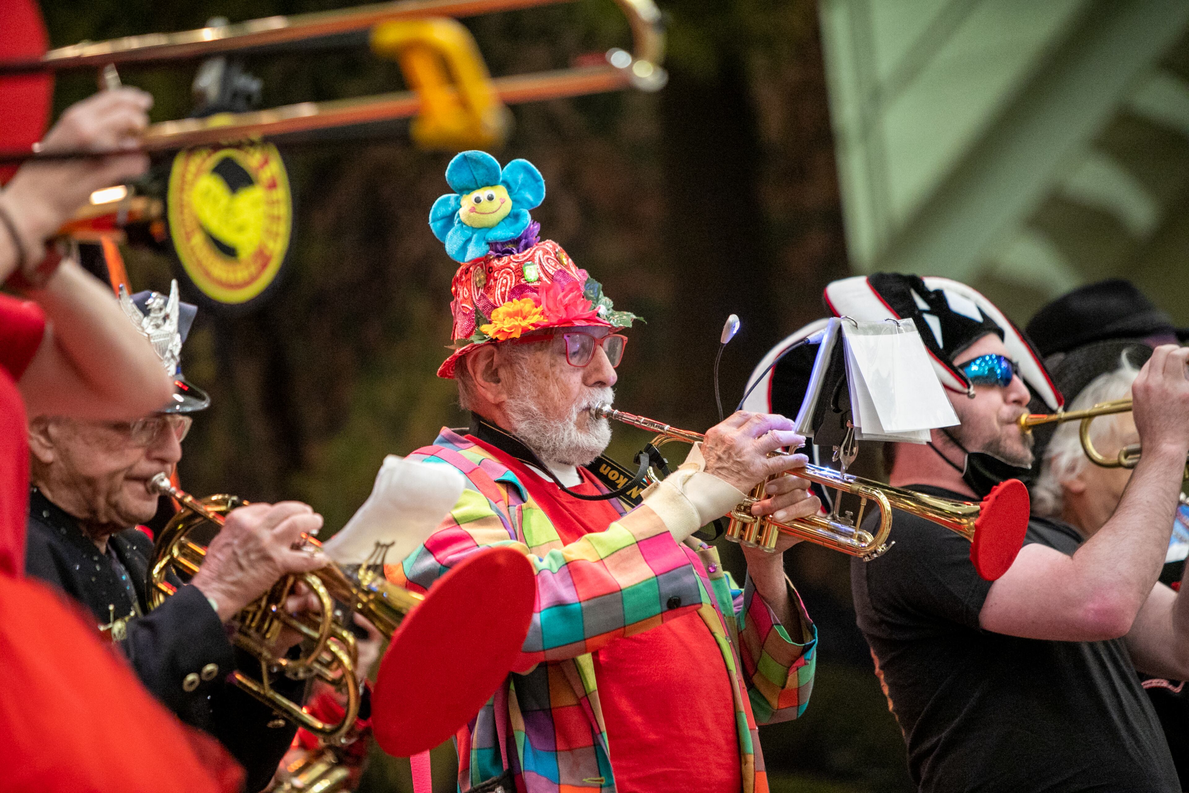 Ivan Andrade, front, plays the trumpet with The Seed and Feed Marching Abominable Band on Saturday, April 2, 2022, at the Yaarab Shrine Center. The band has performed at all 44 Groundhog Day Jugglers Festivals. (Jenni Girtman for The Atlanta Journal-Constitution)