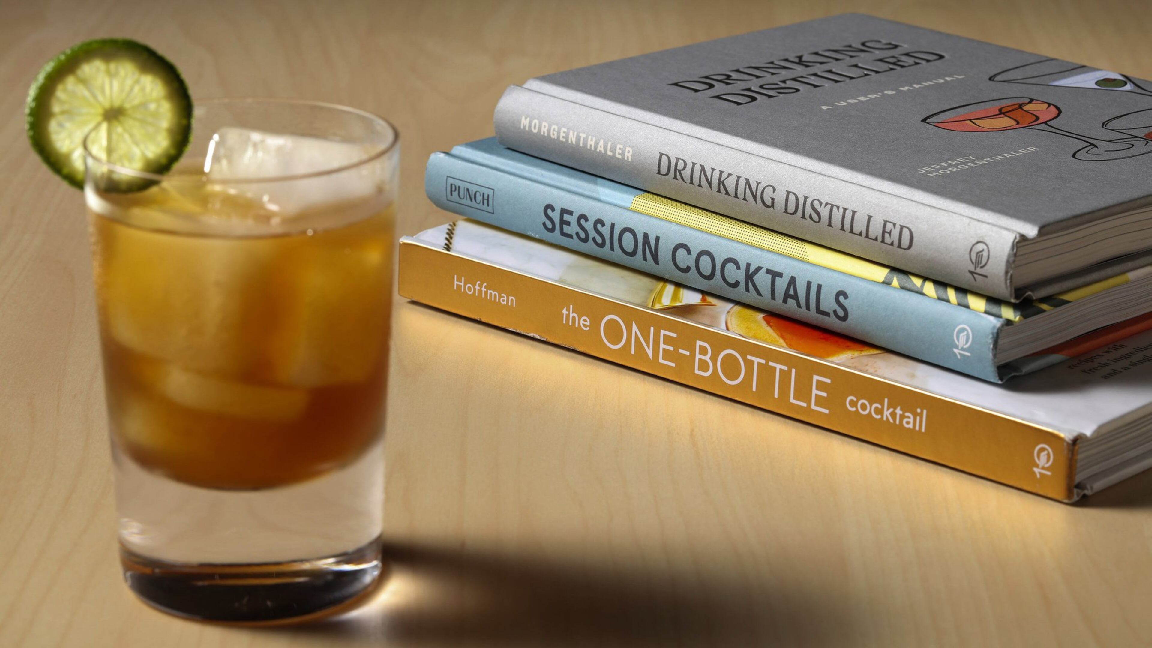 Let these new books, “Drinking Distilled,” from top, “Session Cocktails” and “The One Bottle Cocktail,” guide your summer sipping. Start with a quaffable session margarita, pictured, from “Session Cocktails.” Styled by Shannon Kinsella. (Abel Uribe/Chicago Tribune/TNS)