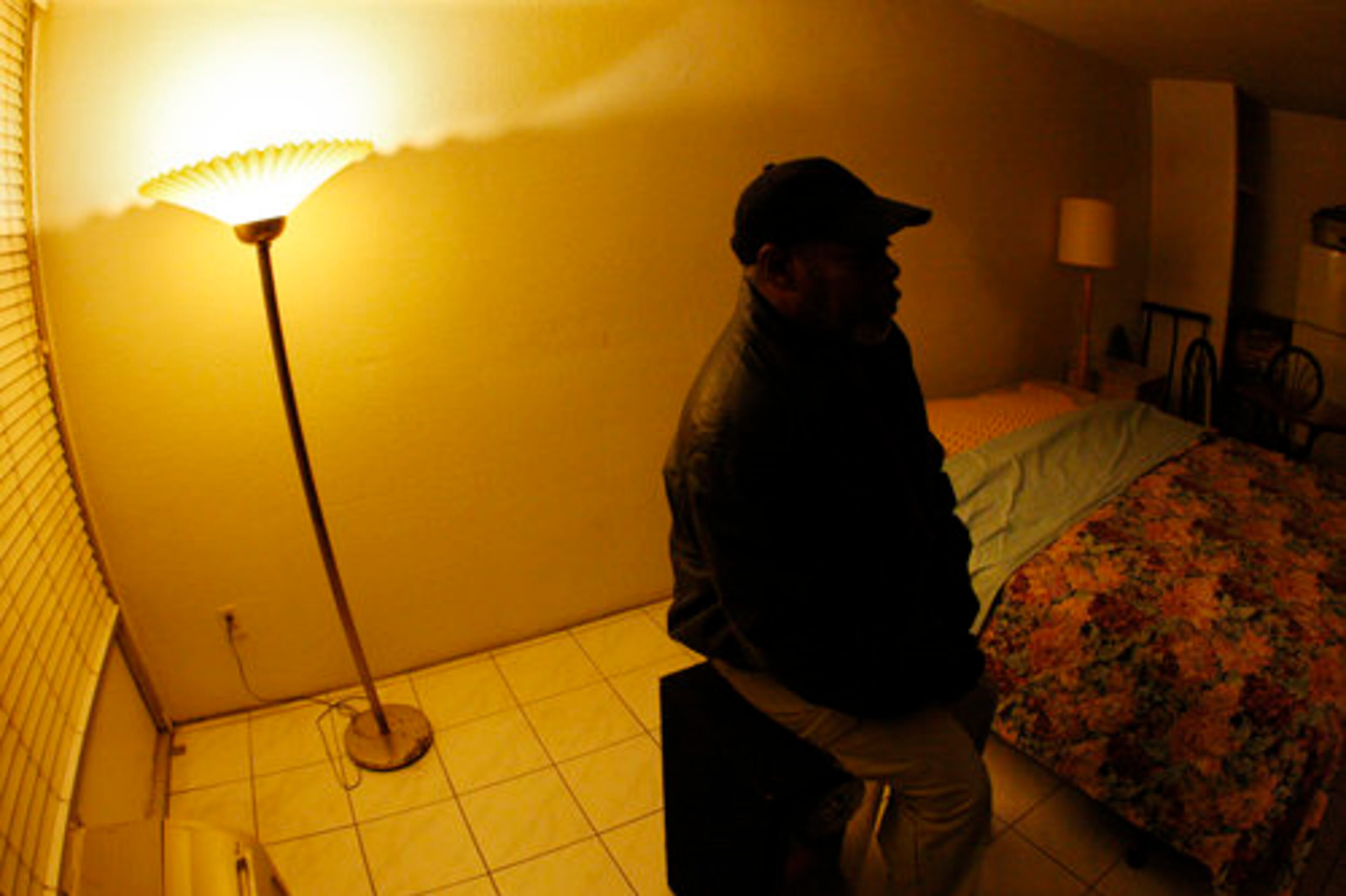 James Lott, 53, sits in his room.