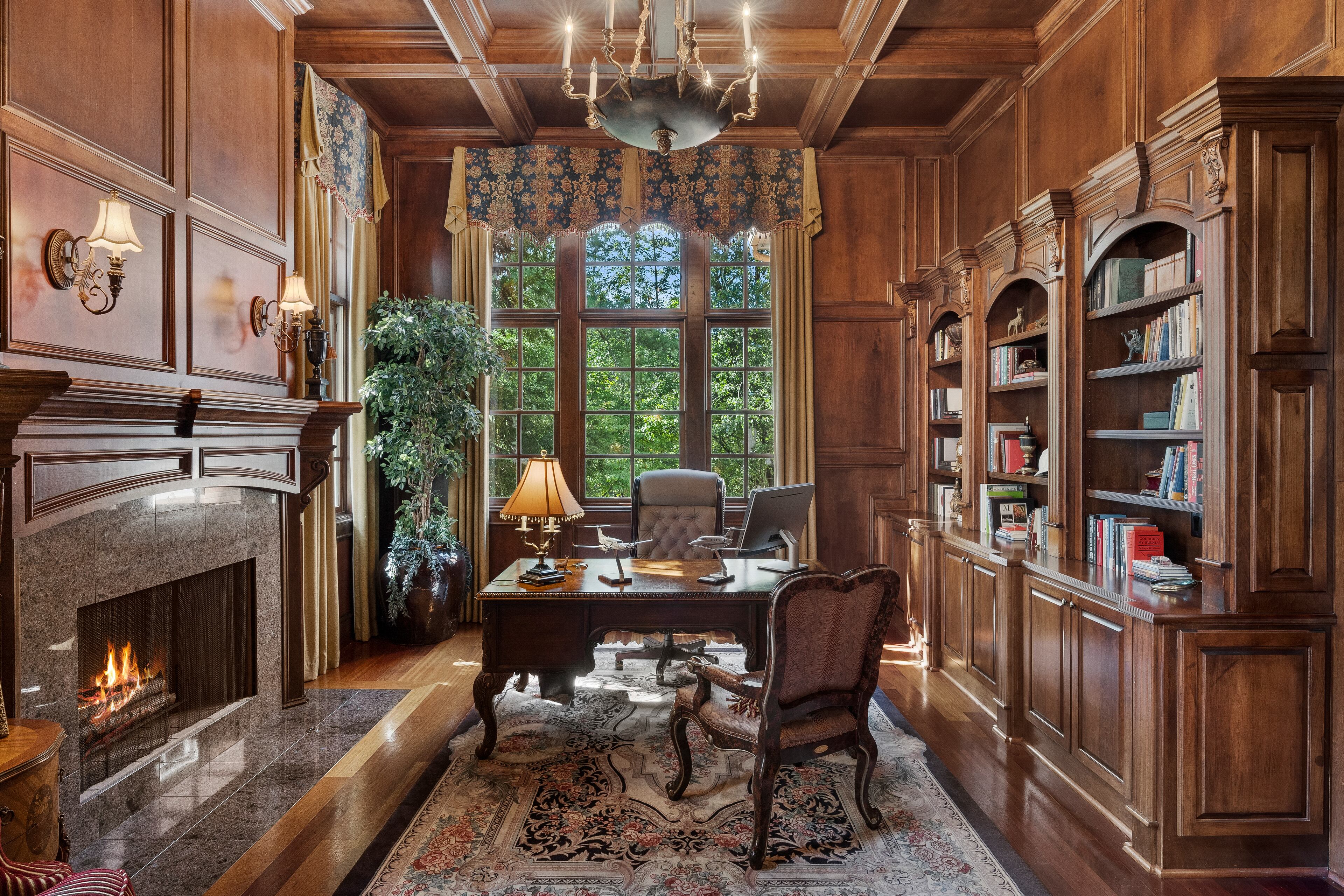 The gentleman's study features a fireplace.