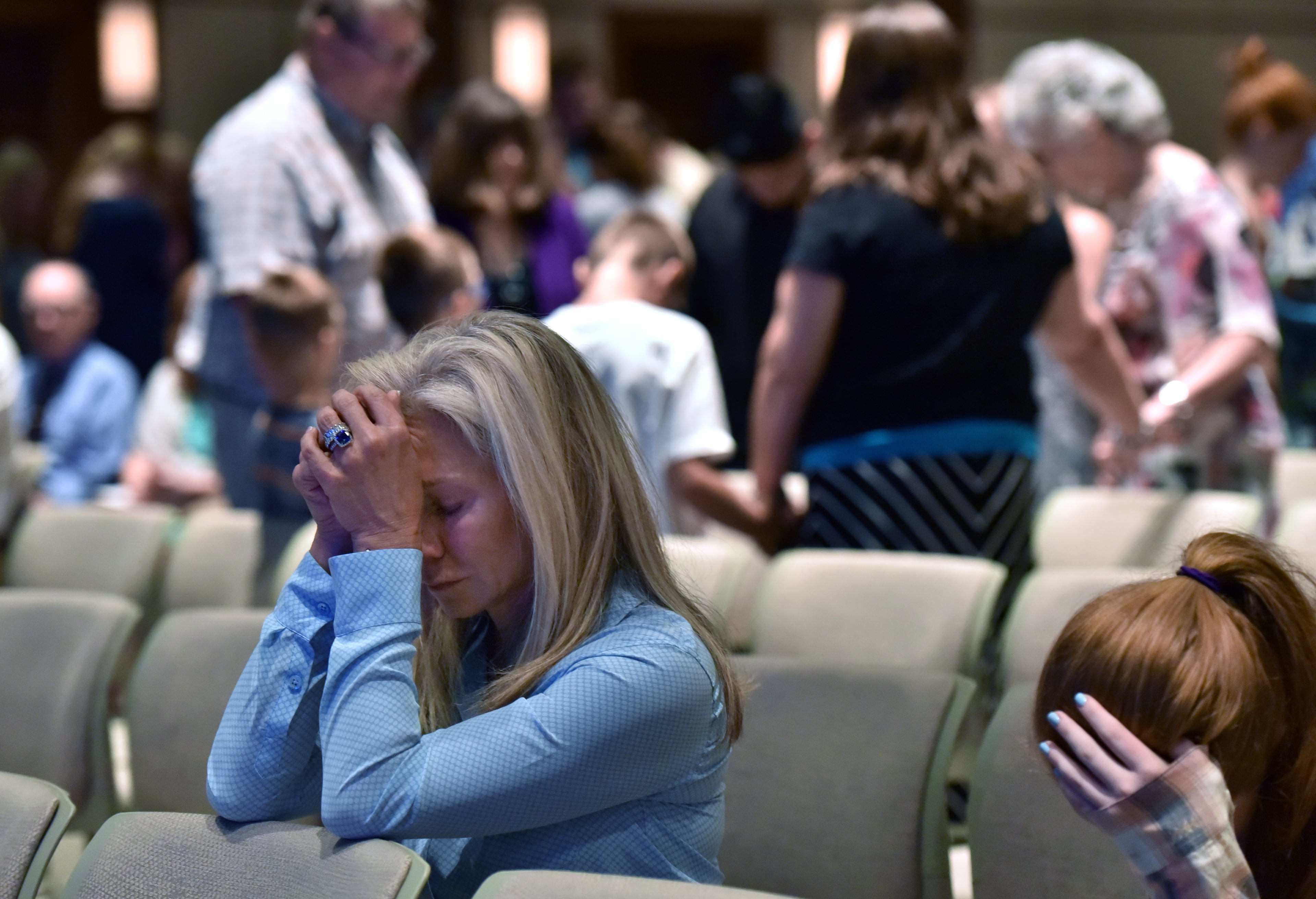 July 10, 2016 Dallas, Texas - Church members join hands as they take part in a service at Park Cities Baptist Church in Dallas on Sunday, July 10, 2016. HYOSUB SHIN / HSHIN@AJC.COM