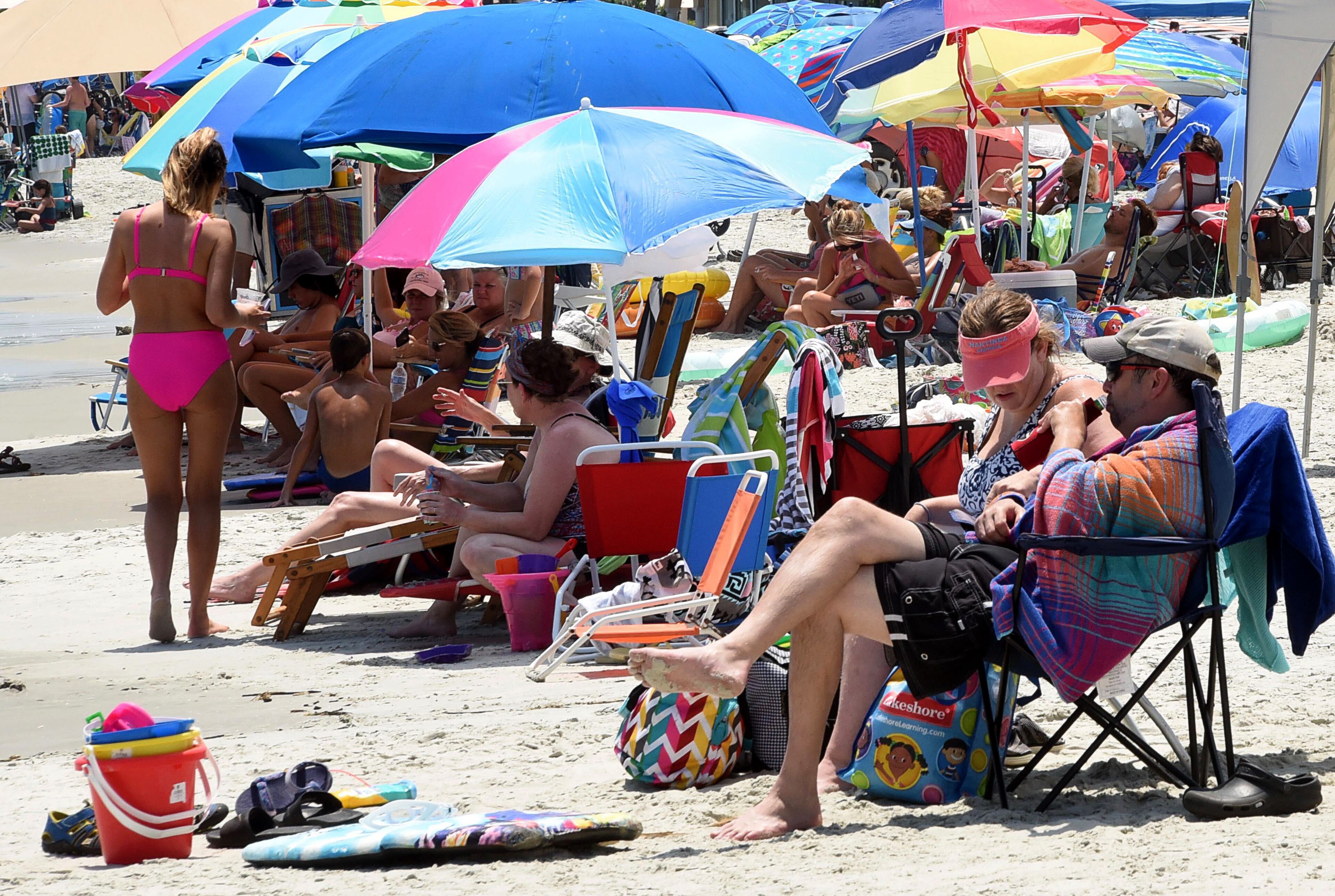 East Beach in Brunswick was packed with people on July 14, 2020. Glynn County — home to Georgia's popular beach getaways of Jekyll, Sea and St. Simons islands — has become a major hotspot for the coronavirus disease, according to an Atlanta Journal-Constitution analysis of state health data. (RYON HORNE / RHORNE@AJC.COM