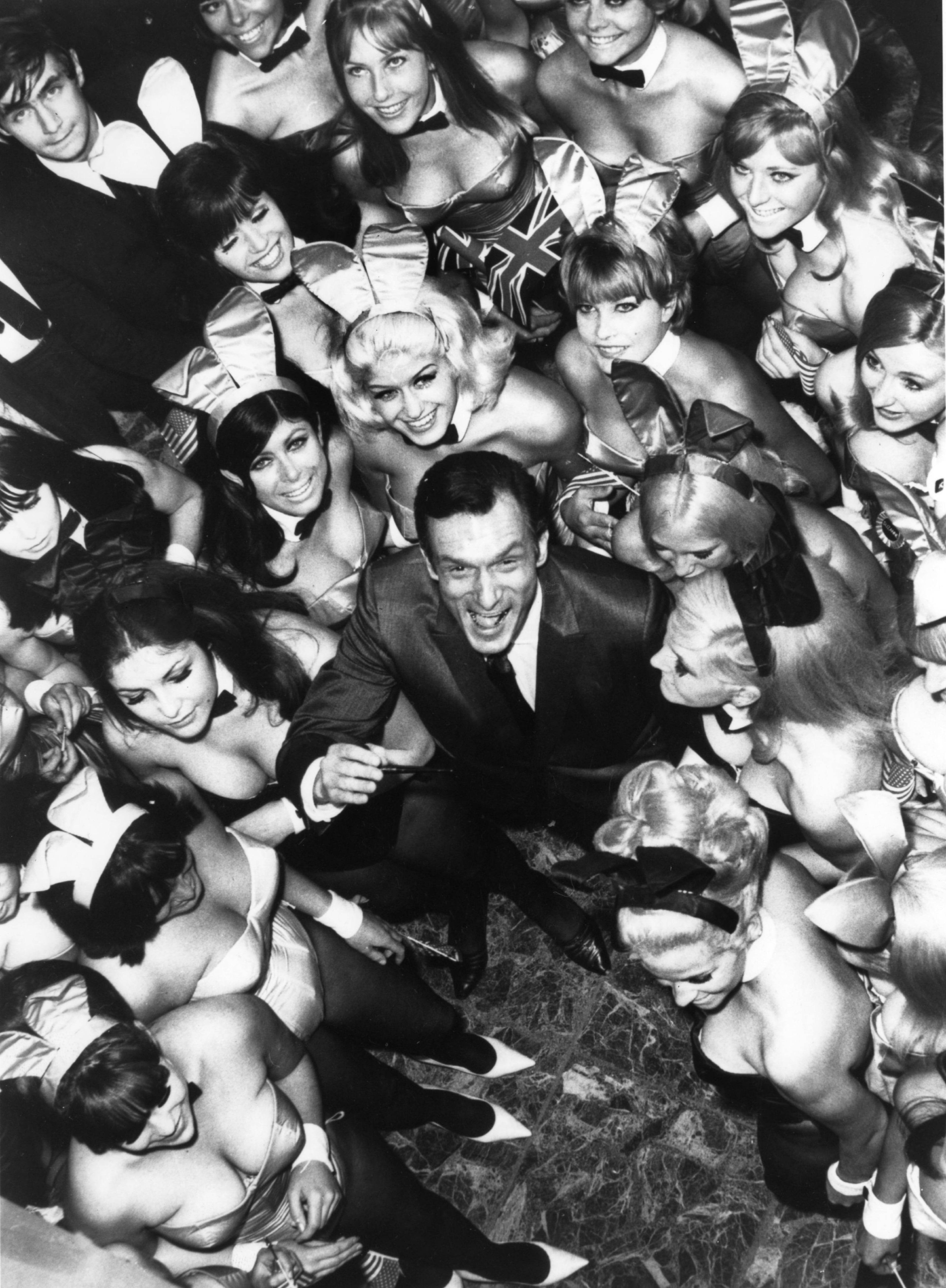 UNITED KINGDOM - AUGUST 26: Hugh Hefner, The Director Of The Play-Boy Newspaper And Club, Pictured Surrounded By 50 Bunnies On June 27, 1966. They Were To Work At His New Club In London (Photo by Keystone-France/Gamma-Keystone via Getty Images)