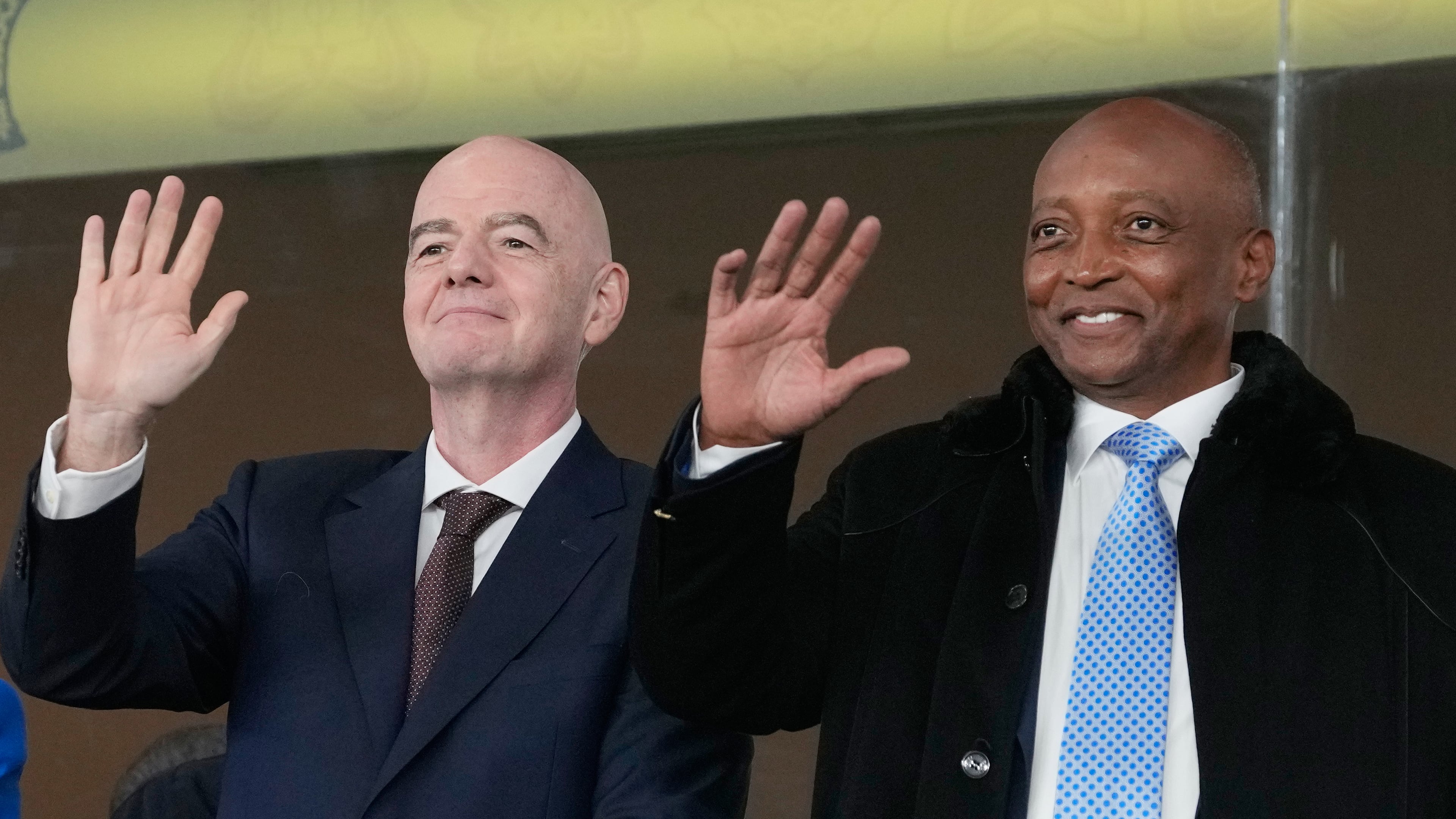 FILE - CAF President Patrice Motsepe and FIFA President Gianni Infantino wave from the tribune during the Africa Cup of Nations round of 16 soccer match between South Africa and Cameroon in Rabat, Morocco, Sunday, Jan. 4, 2026. (AP Photo/Themba Hadebe, File)