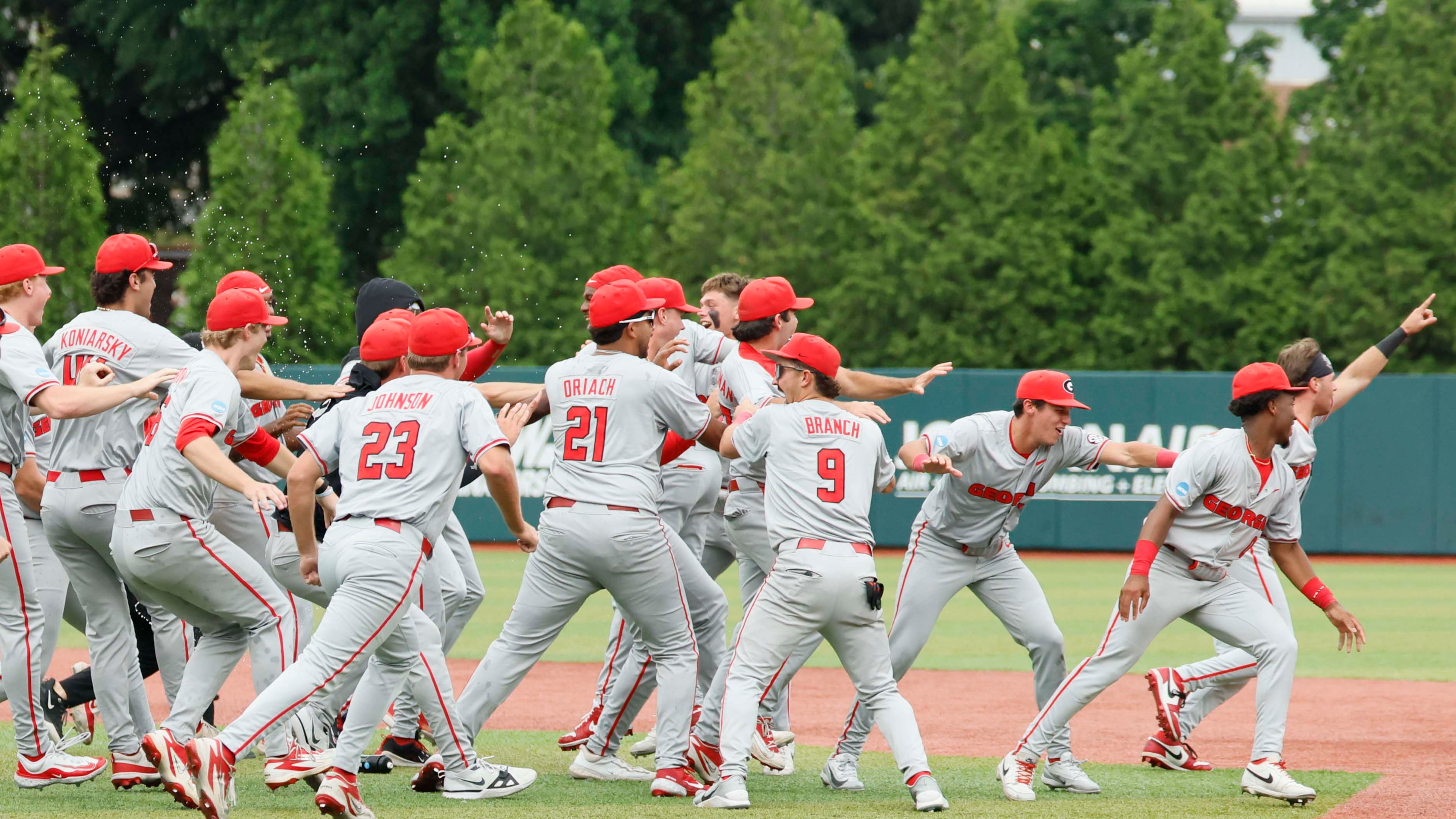 Georgia players celebrate after winning their NCAA super regional series over Mississippi State on Sunday, June 7, 2026, in Athens. The Bulldogs come into the College World Series as the No. 3 seed, the highest-remaining seed still playing. (Miguel Martinez/AJC)
