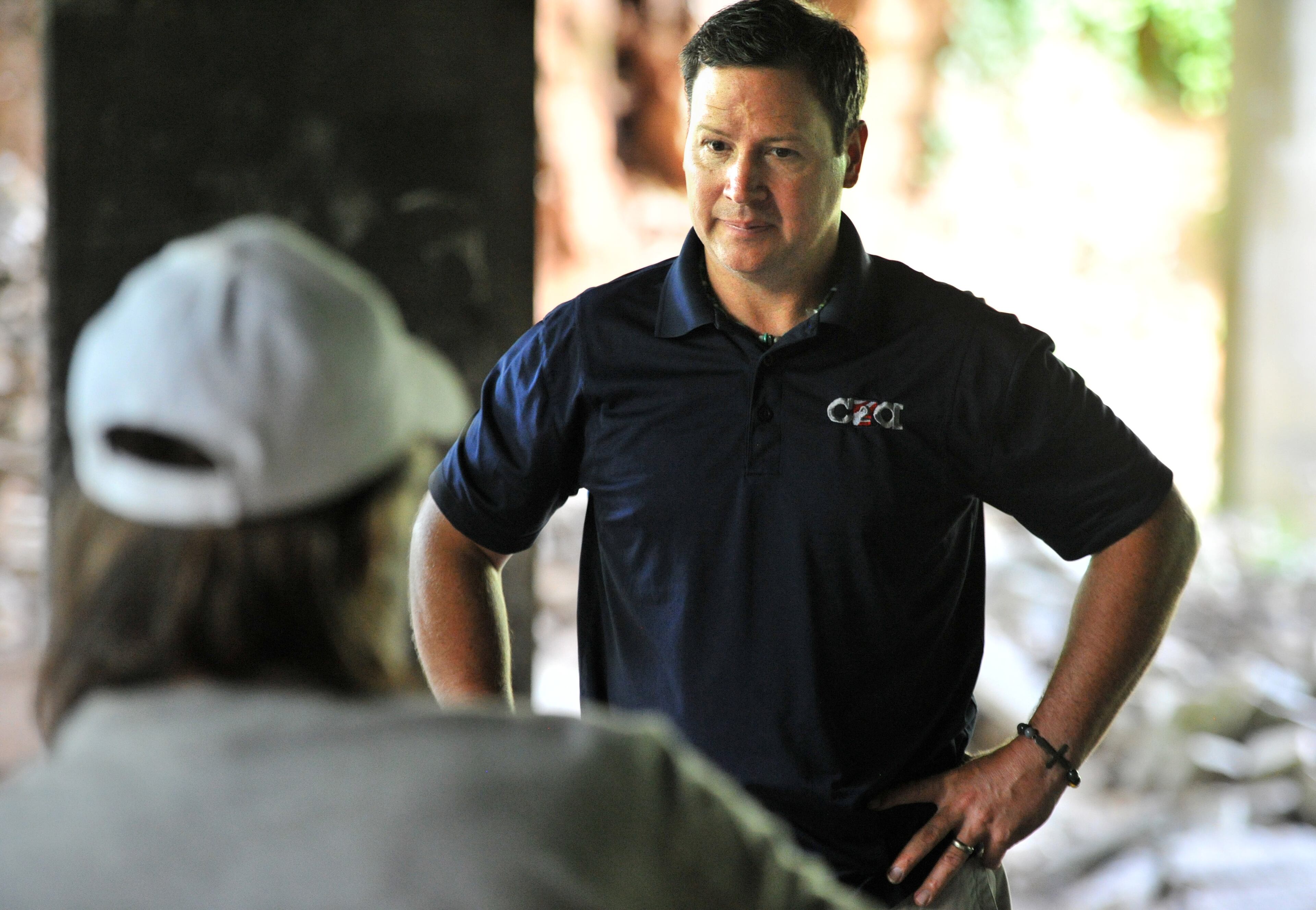 Jeremy Turner, executive director of Contribute2America, listens to a homeless man after delivering food, supplies and personal items near Buford Highway in Atlanta. Jeremy Turner is a driven man, driven by the memory of his dad, driven by his belief that no one should live under a bridge.