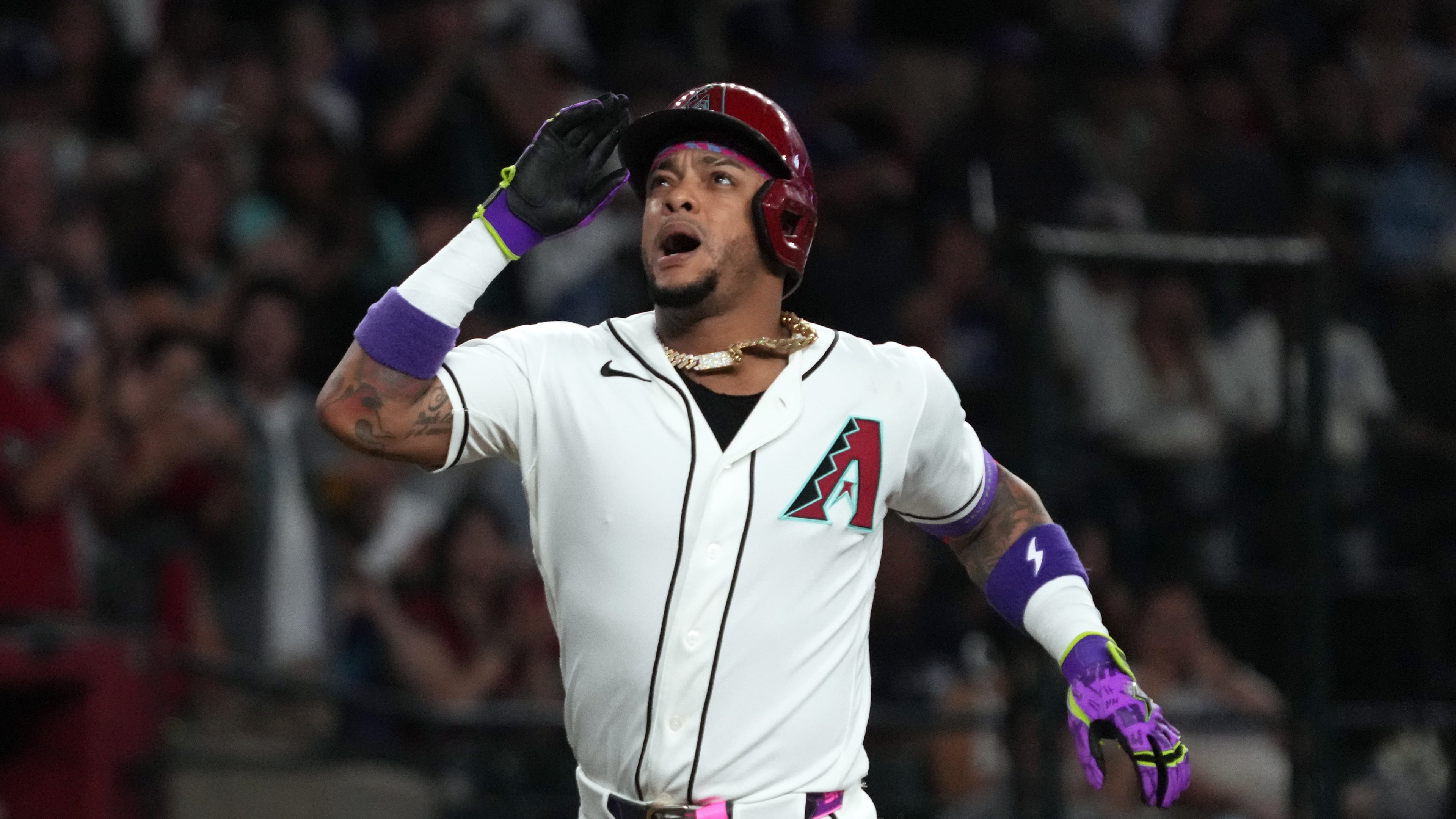 Arizona Diamondbacks' Ketel Marte reacts after hitting a two-run home run against the Los Angeles Dodgers in the first inning of a baseball game, Sunday, Aug 9, 2026, in Phoenix. (AP Photo/Rick Scuteri)