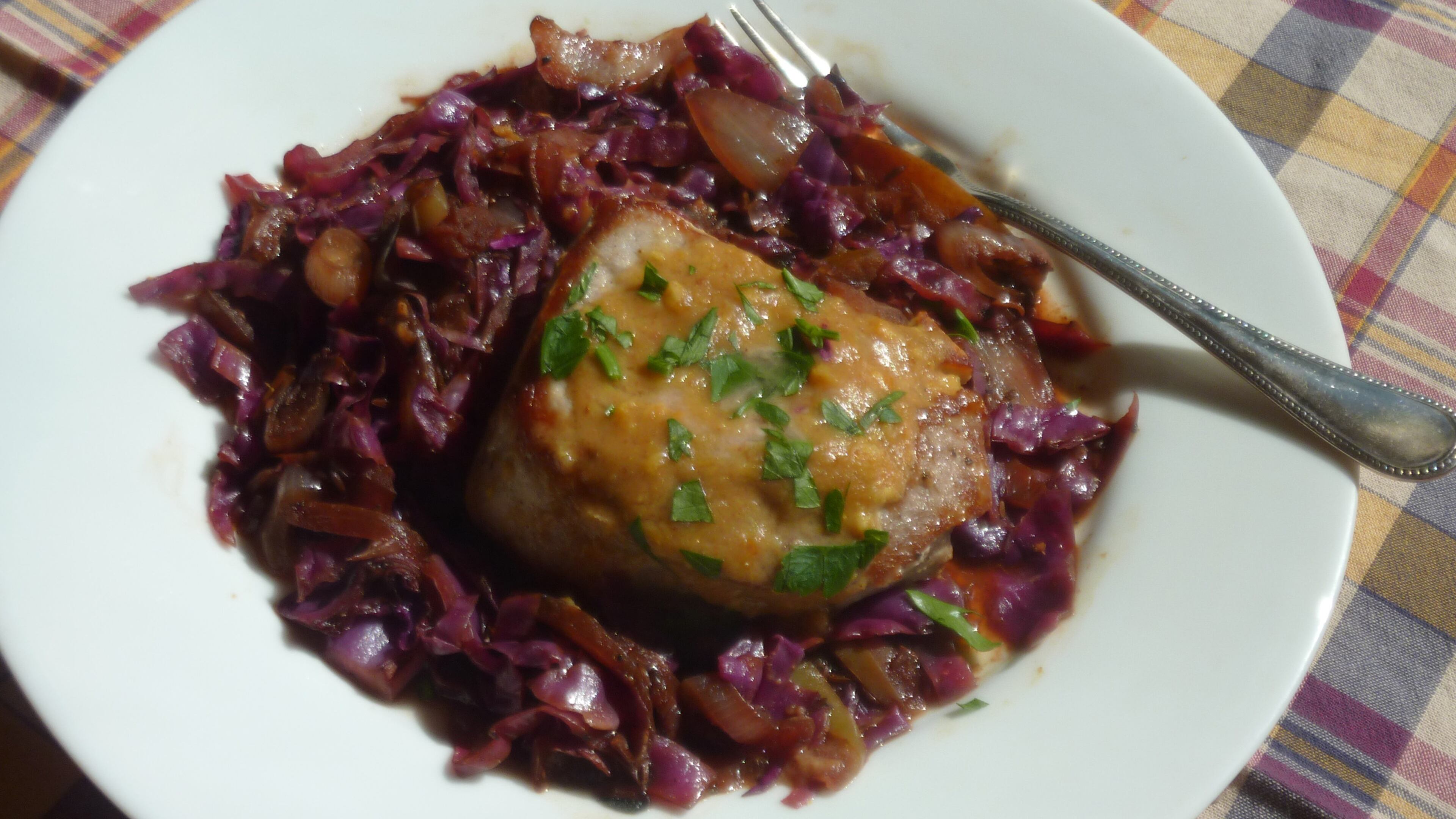 Caraway-scented red cabbage combines with sauteed pork for this one-pot dinner. (Linda Gassenheimer/TNS)