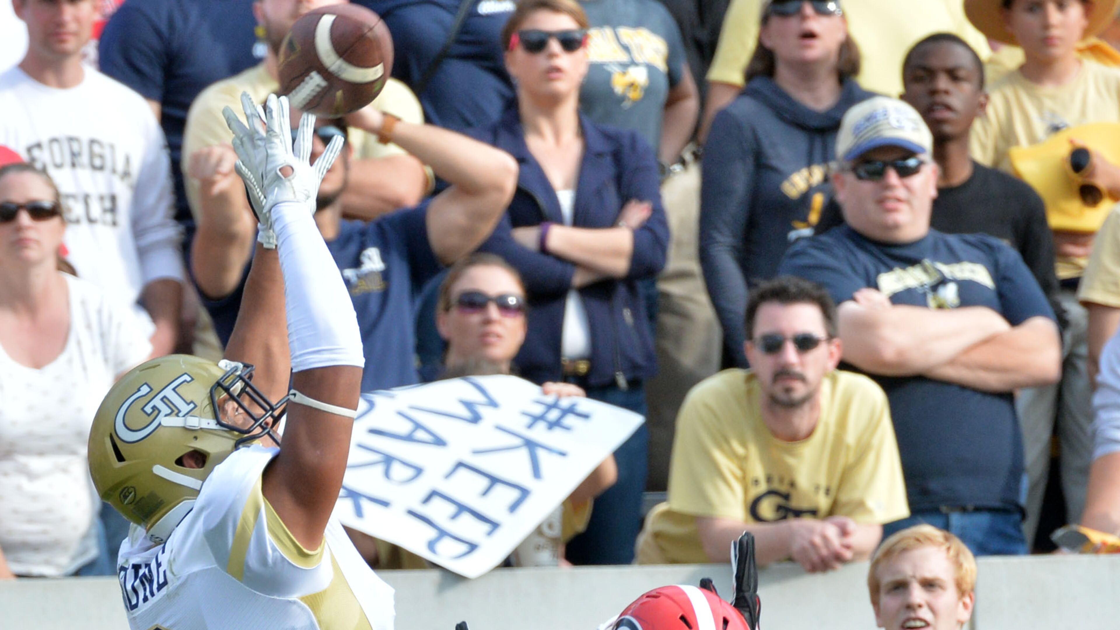 November 28, 2015 Atlanta - Georgia Tech Yellow Jackets wide receiver Ricky Jeune (2) catches a touchdown pass under pressure from Georgia Bulldogs cornerback Malkom Parrish (14) in the second half at Bobby Dodd Stadium on Saturday, November 28, 2015. Georgia Bulldogs won 13 - 7 over the Georgia Tech Yellow Jackets. HYOSUB SHIN / HSHIN@AJC.COM