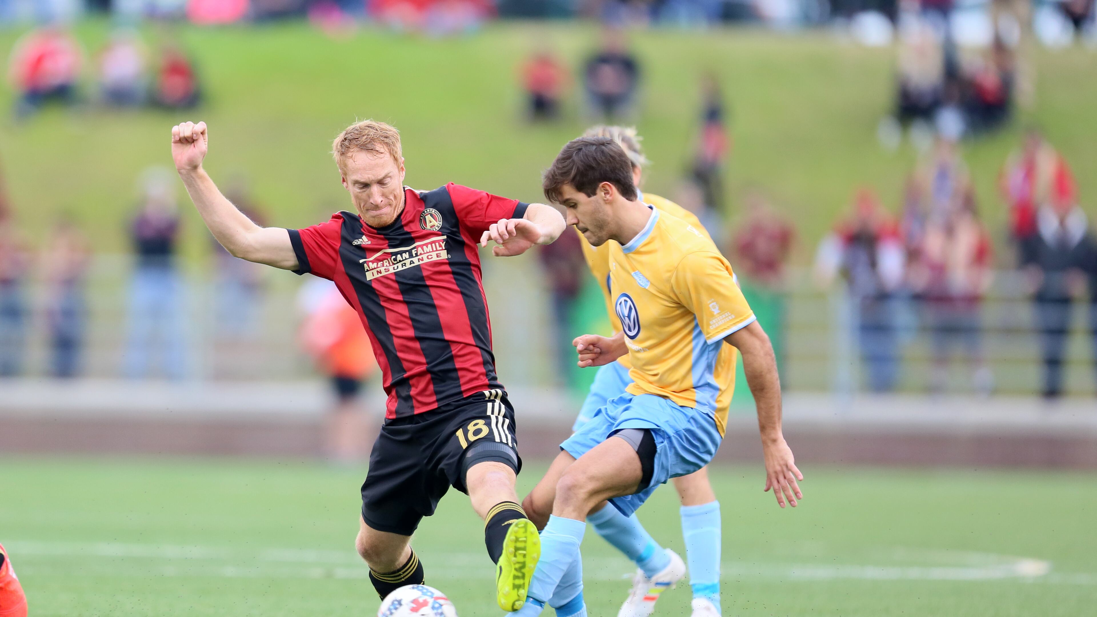 FEBRUARY 11, 2017 CHATTANOOGA TN Midfielder Jeff Larentowicz (18) try to pass a Chattanoga defender.