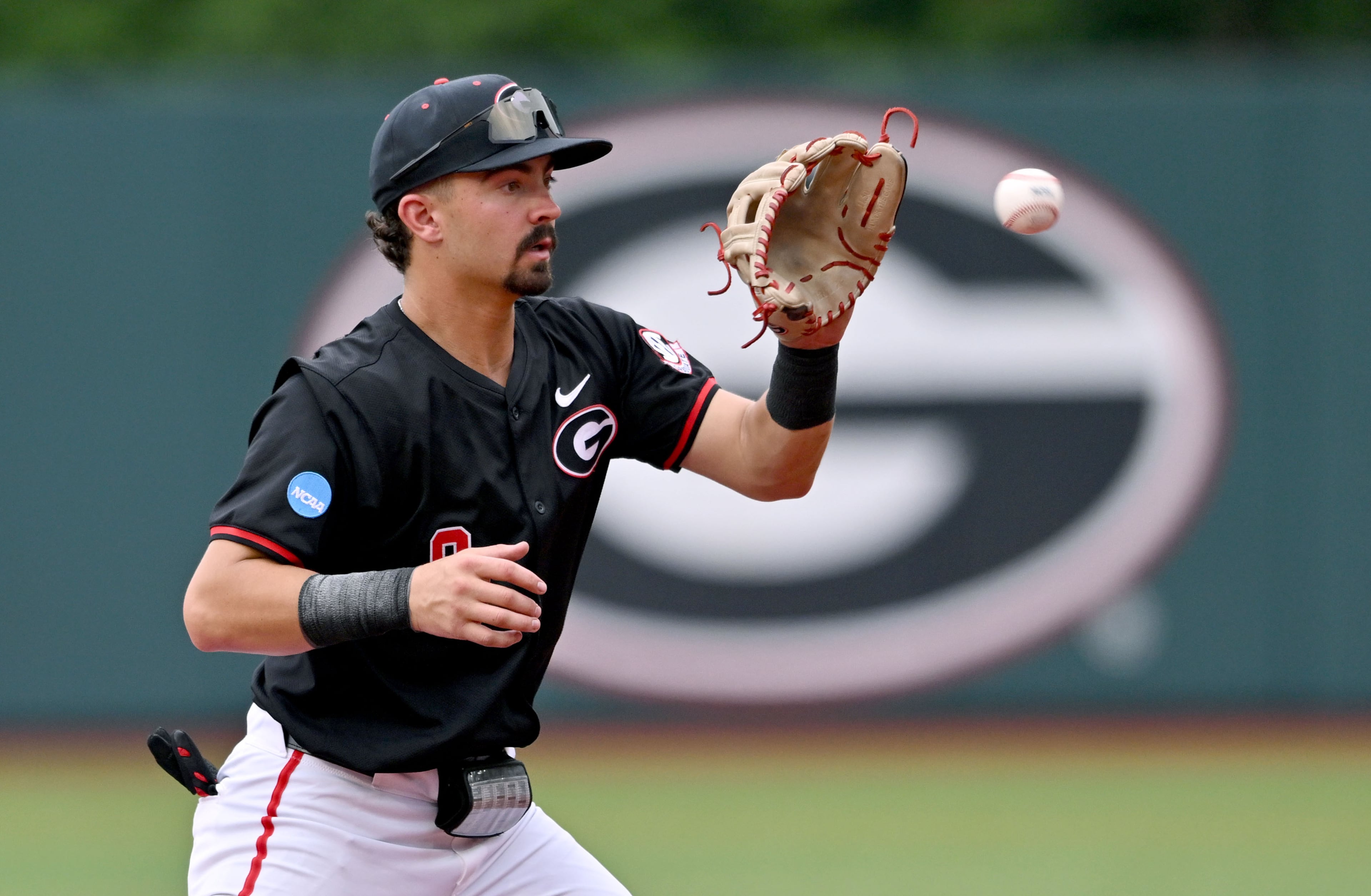 Georgia infielder Kolby Branch (9) makes a catch during the second inning of their NCAA Regional game at Foley Field, Friday, May 29, 2026, in Athens. (Hyosub Shin/AJC)