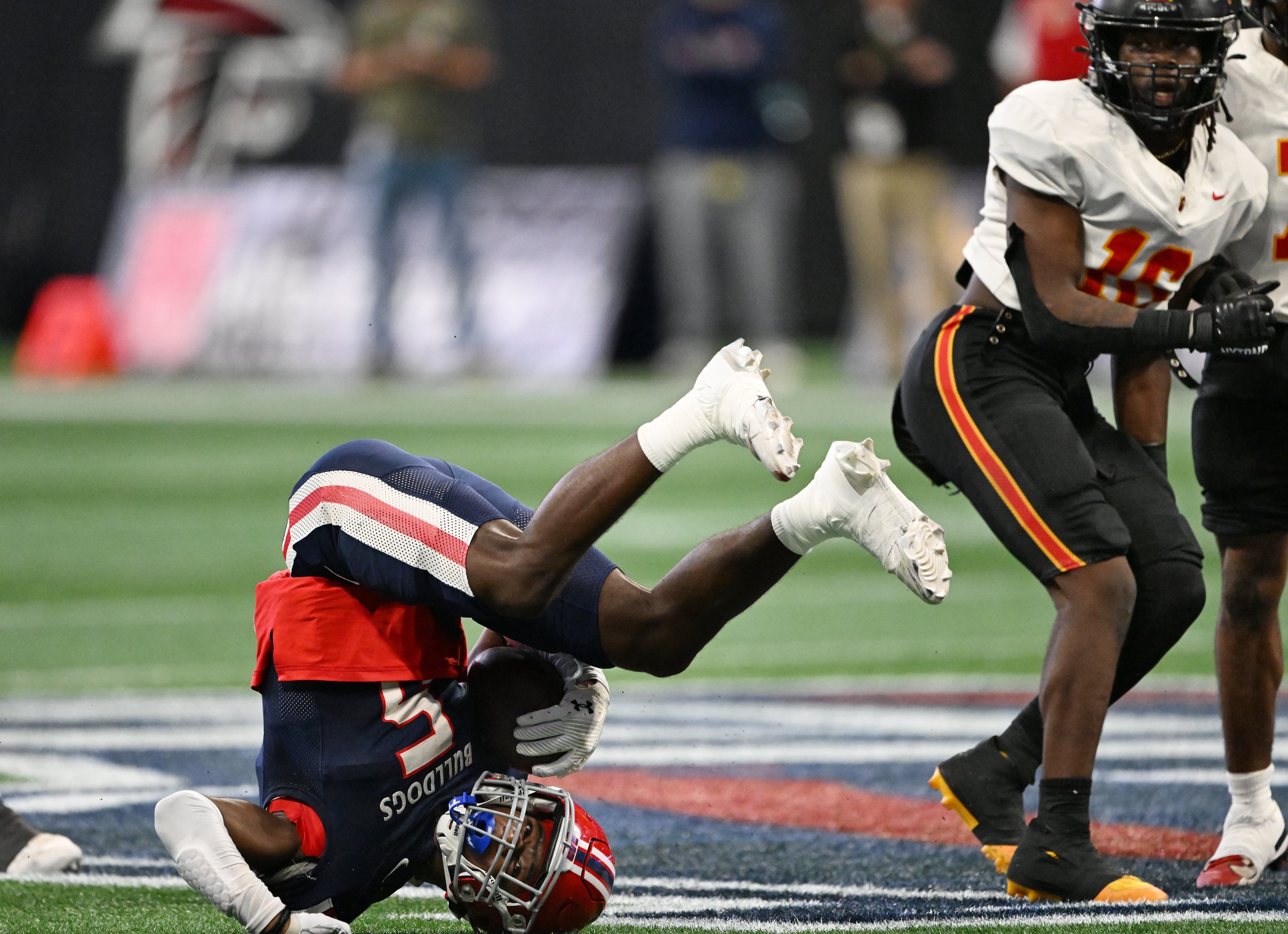 Toombs County receiver Mike Polke (5) falls after a catch during the first half in GHSA Class A-Division State Championship game at Mercedes-Benz Stadium, Tuesday, December 17, 2024, in Atlanta. (Hyosub Shin / AJC)
