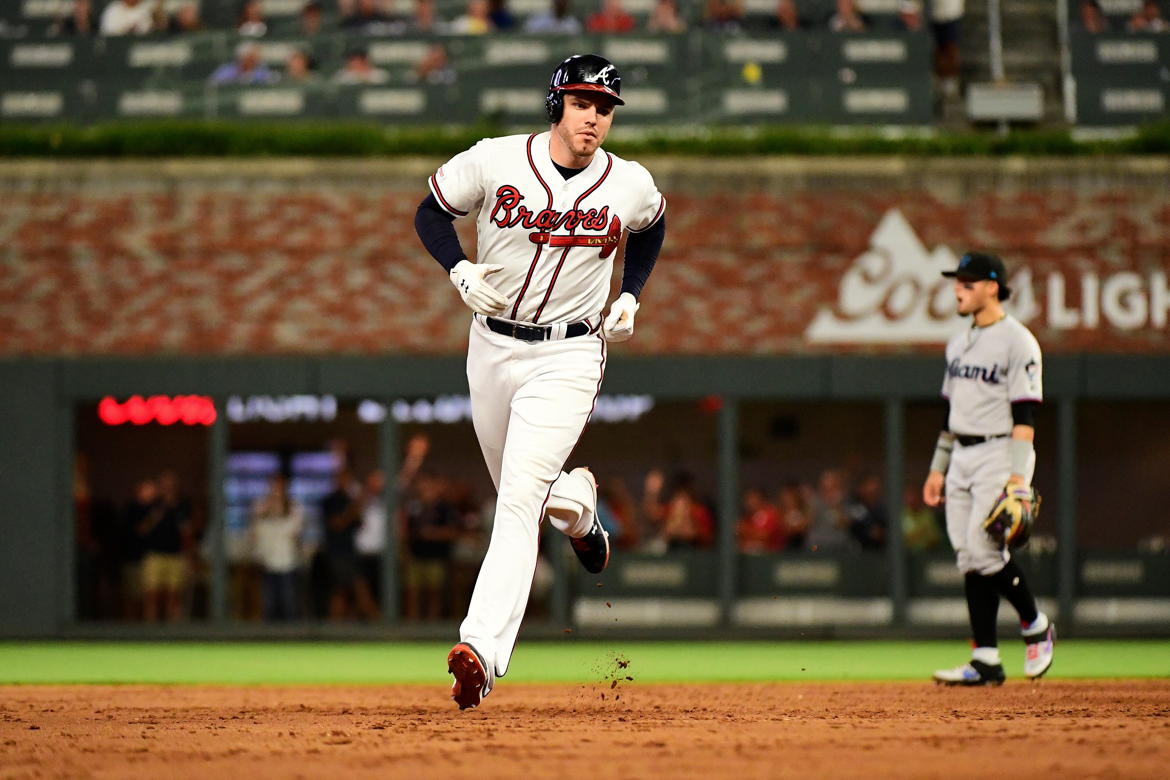 Freddie Freeman #5 of the Atlanta Braves hits a home run in the eighth inning against the Miami Marlins at SunTrust Park on August 22, 2019 in Atlanta, Georgia. (Photo by Logan Riely/Getty Images)